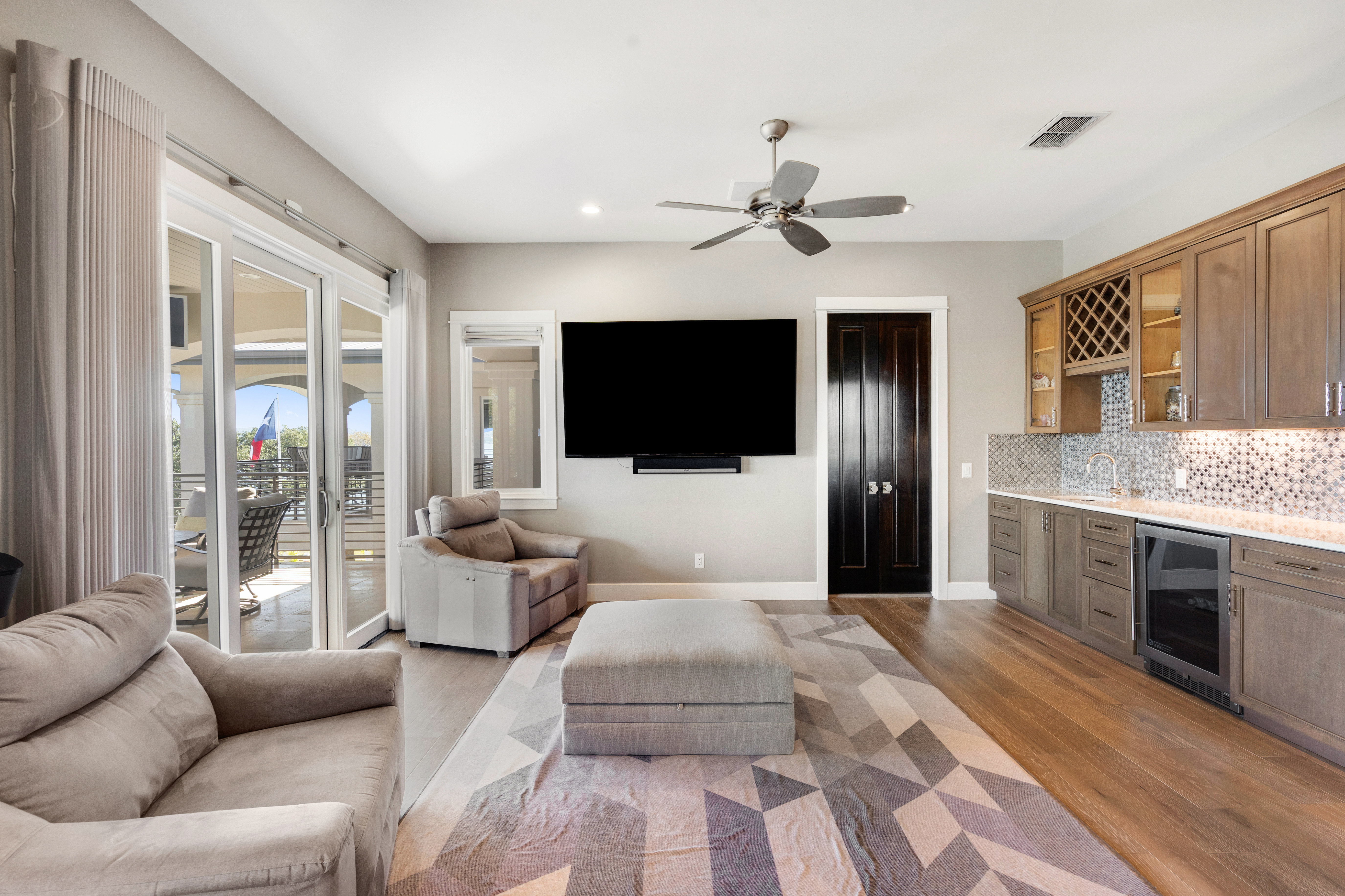 15210 Rainbow 1 Street Austin, TX 78734 - Photo 58 of 138 a living room with furniture a flat screen tv and a fireplace