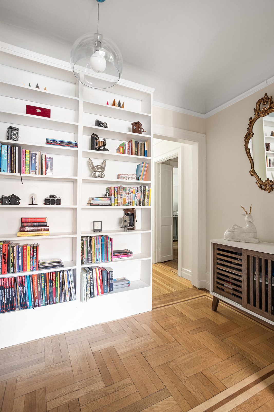 33-39 80th Street, Unit 2 Queens, NY 11372 - Photo 12 of 19 a view of a livingroom with shelves