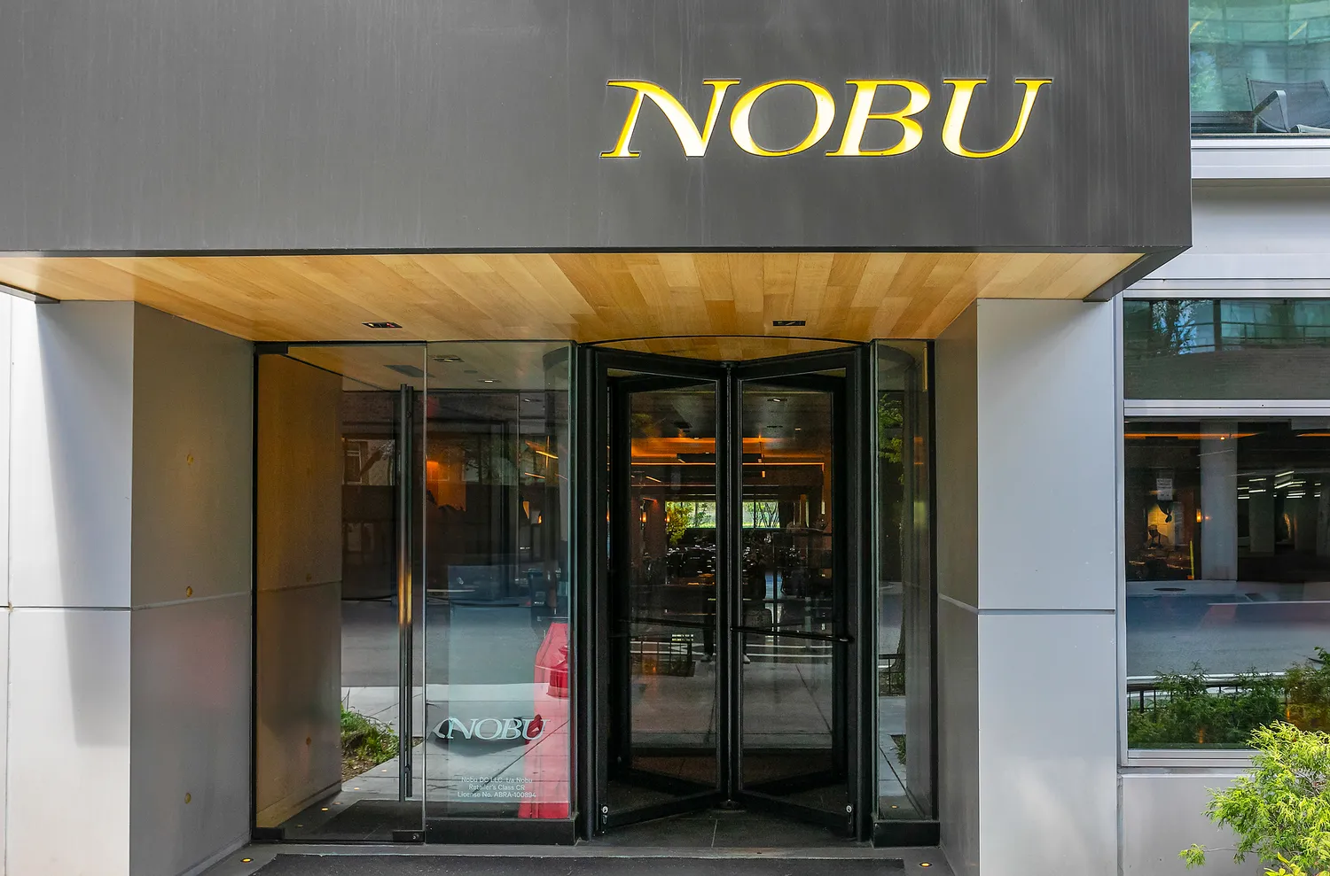 a view of a building with a umbrellas