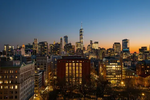 a view of a city with tall buildings