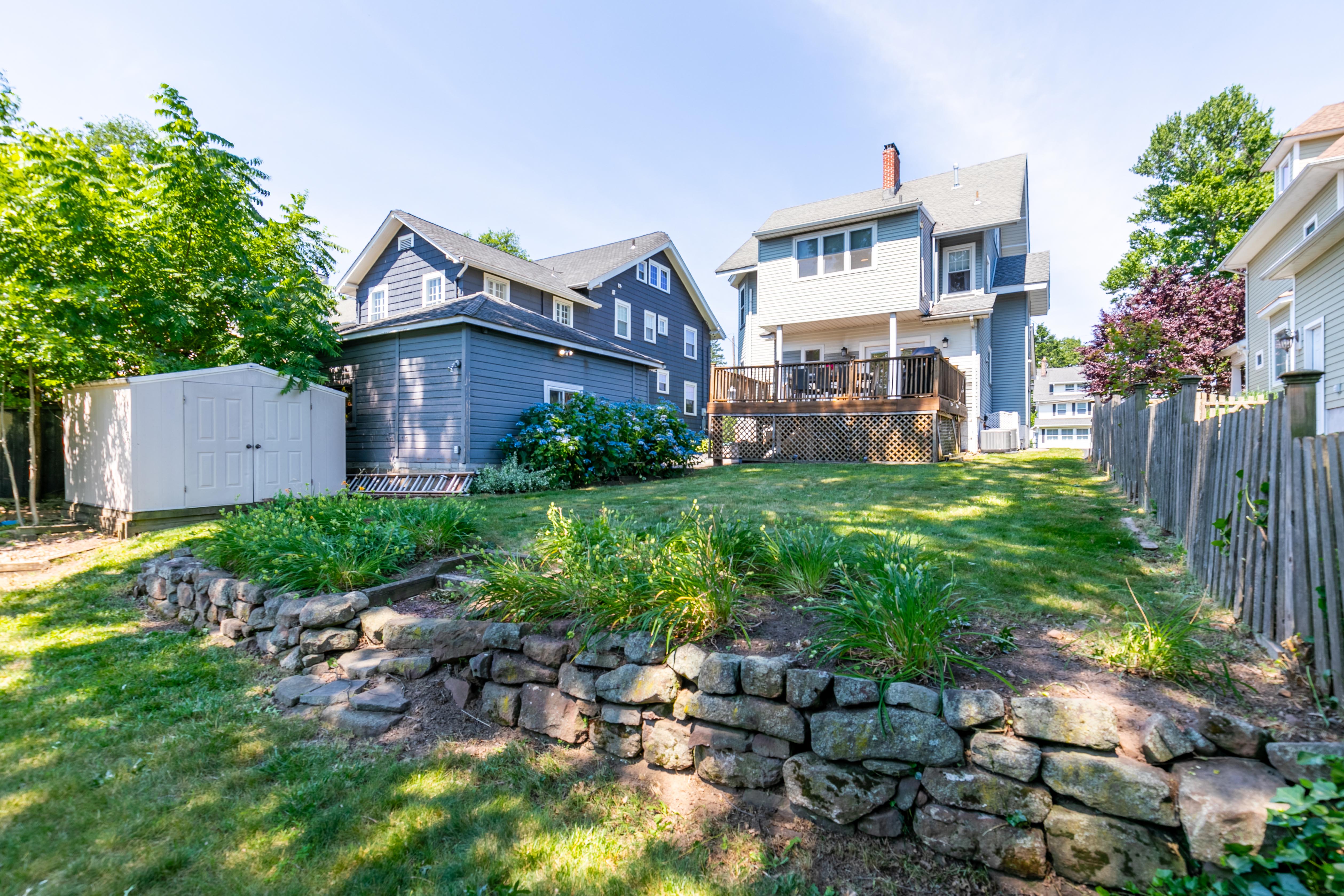 163 Ridge Road Rutherford, NJ 07070 - Photo 48 of 59 a view of a house with a back yard