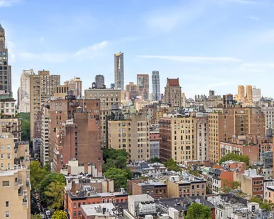 a view of a city with tall buildings