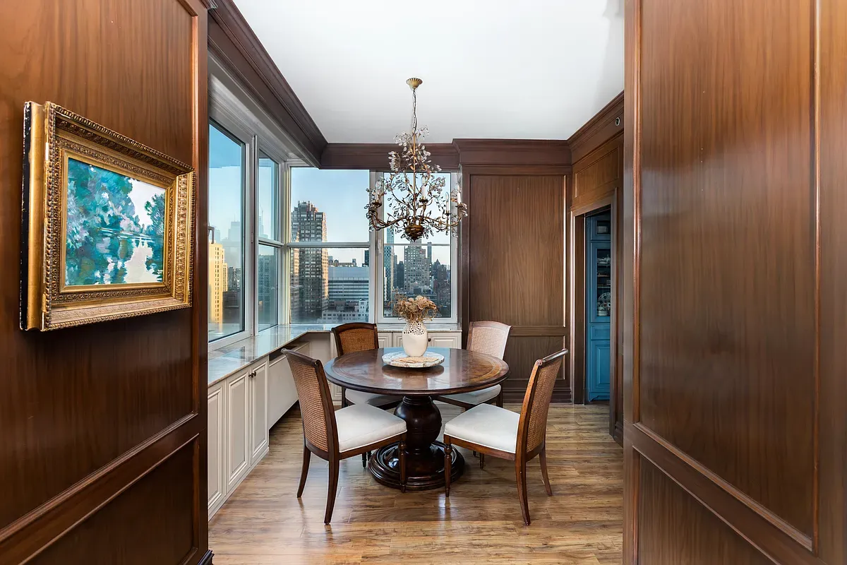 a dining room with furniture window and outside view