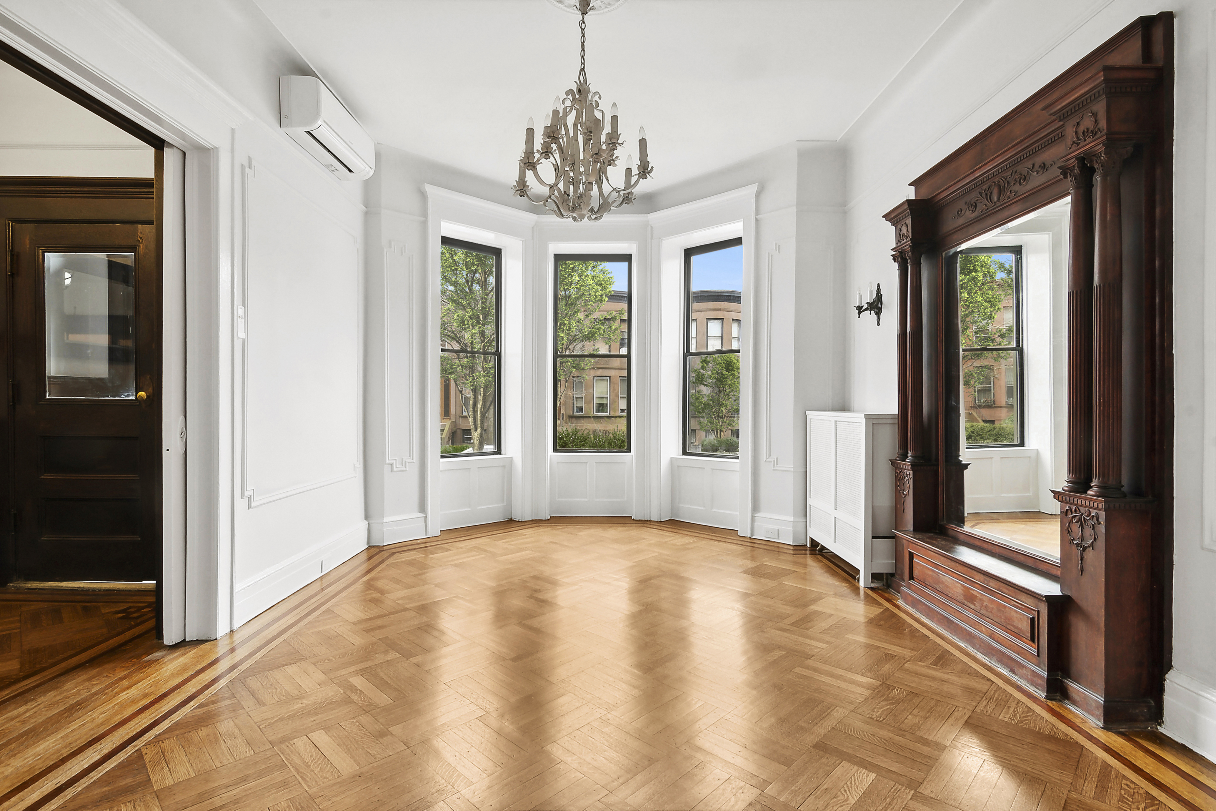 195 Rutland Road Brooklyn, NY 11225 - Photo 5 of 21 a view of a hallway with a chandelier and living room