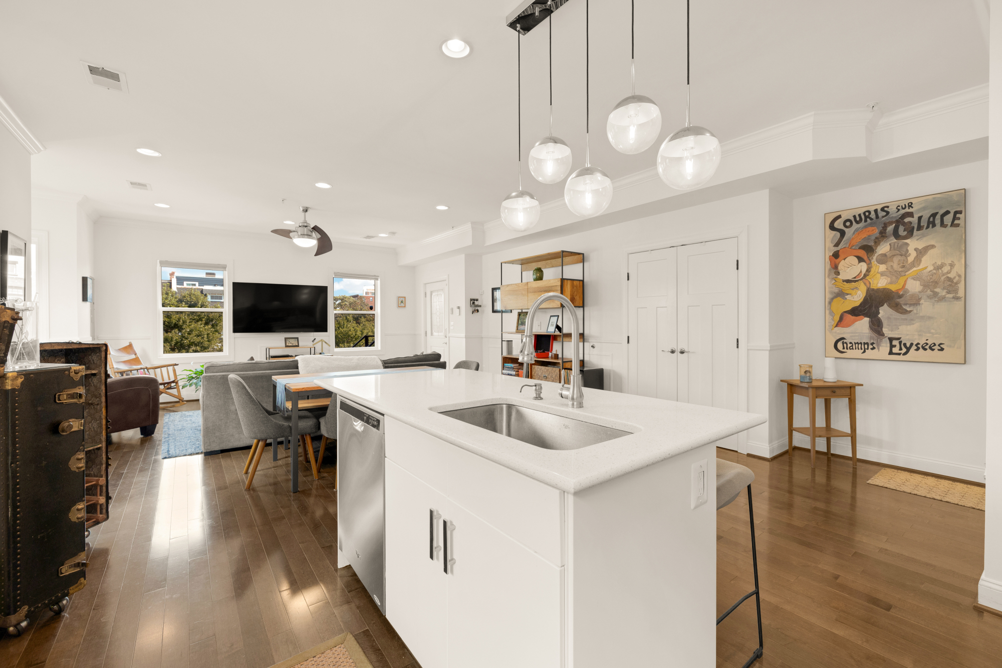 233 S Street Northeast, Unit 4 Washington, DC 20002 - Photo 15 of 37 a living room with furniture a flat screen tv and kitchen view