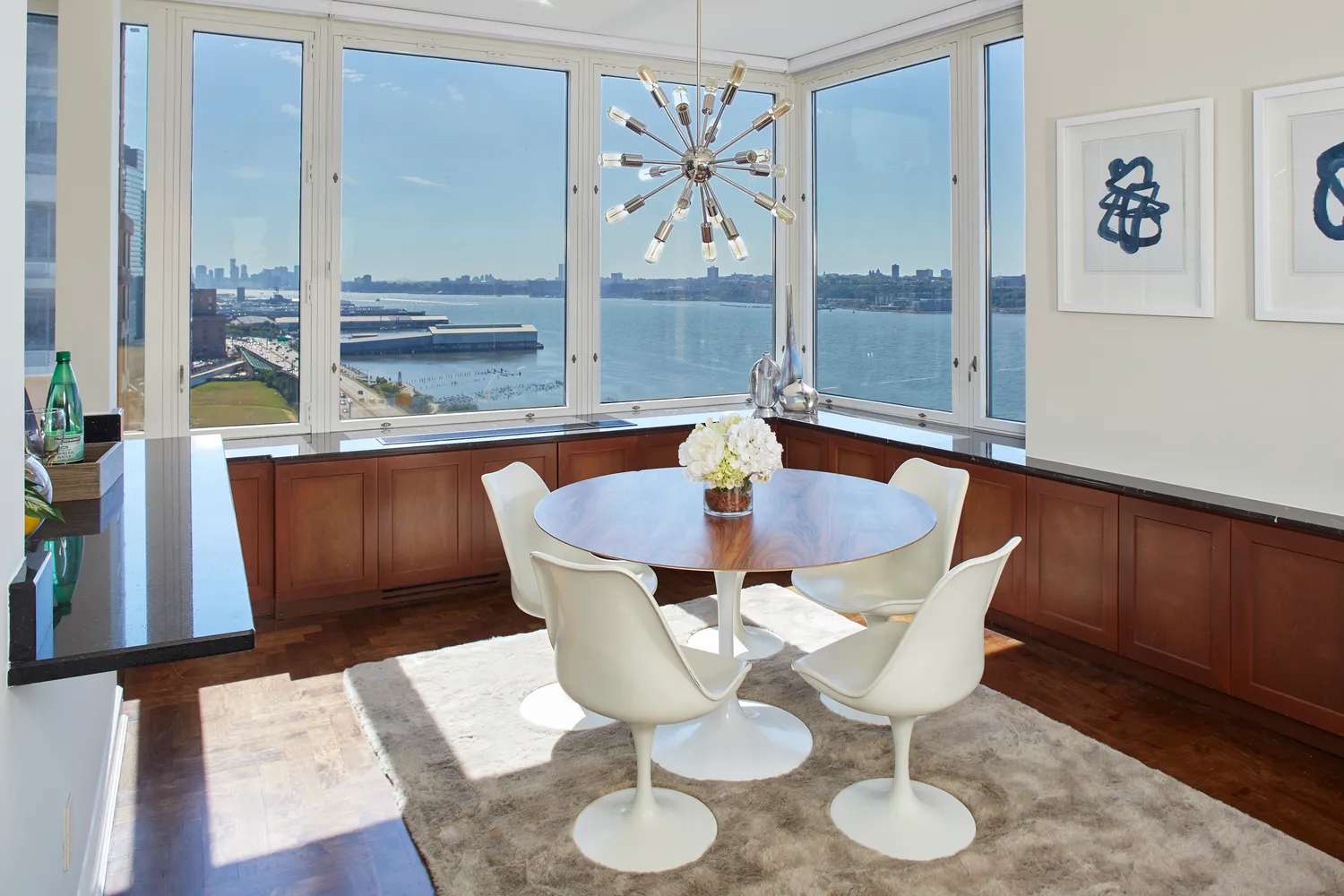 a dining room with furniture and wooden floor