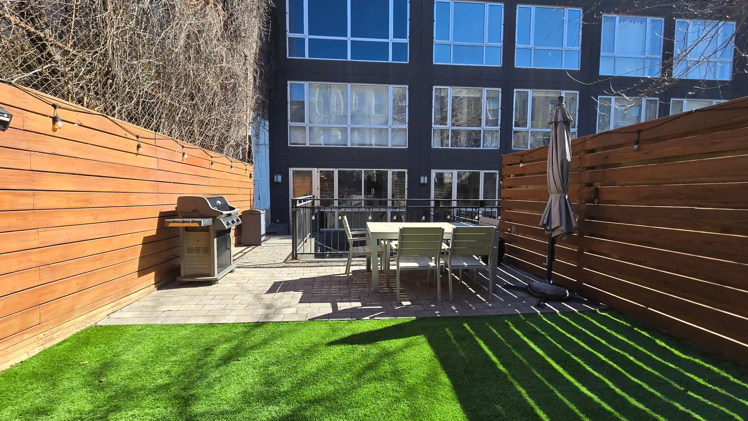 a view of backyard with sitting area
