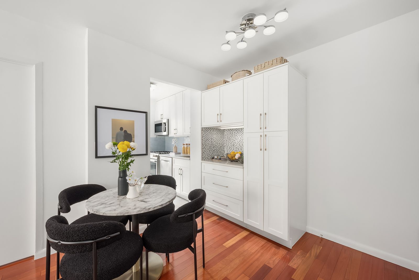 178 East 80th Street, Unit 7F Manhattan, NY 10075 - Photo 4 of 10 a view of a dining room with furniture and wooden floor
