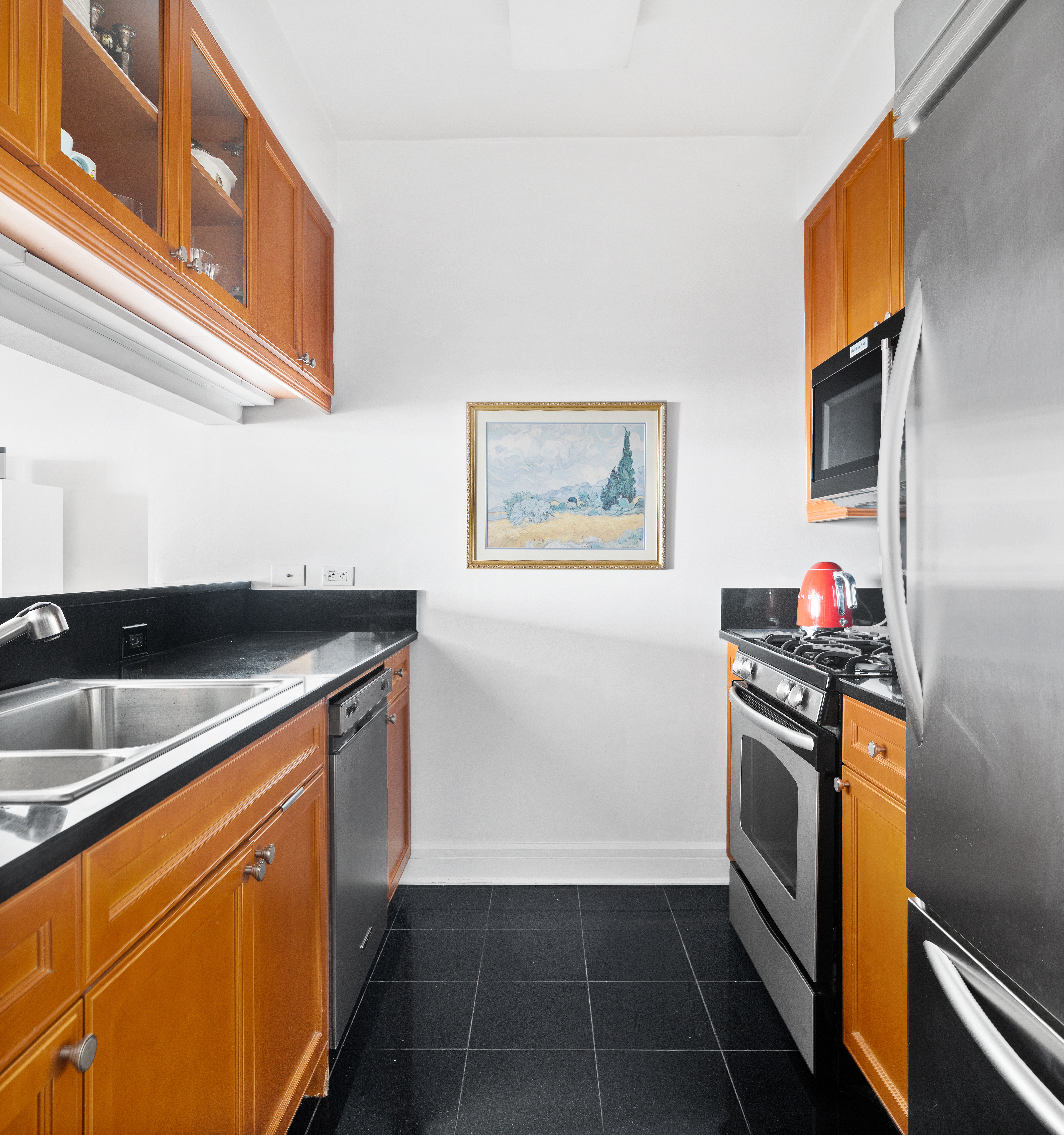 220 Riverside Boulevard, Unit 7G Manhattan, NY 10069 - Photo 2 of 11 a kitchen that has a sink and a stove
