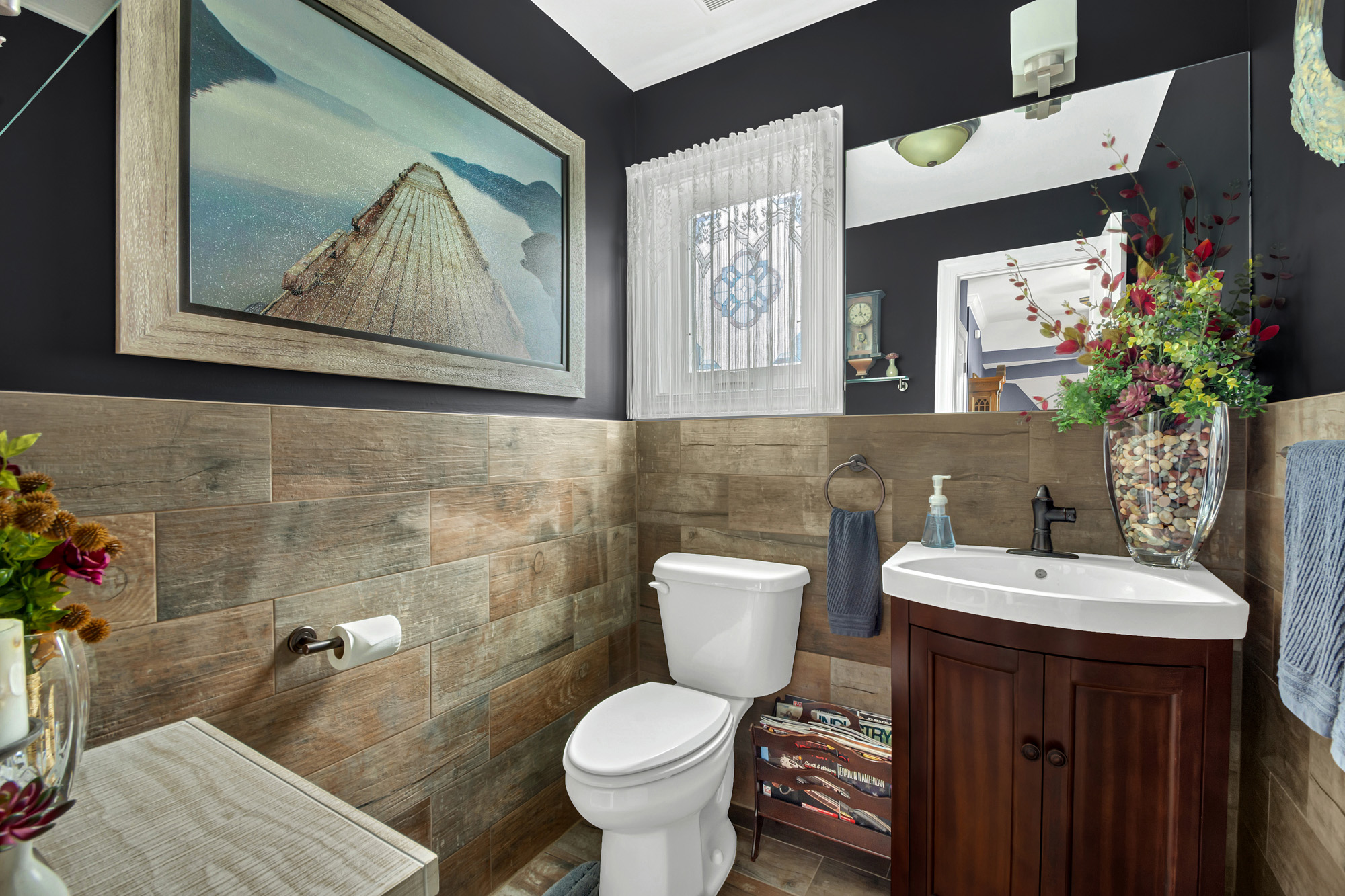 909 Jewett Avenue Staten Island, NY 10314 - Photo 17 of 65 a bathroom with a toilet sink and mirror