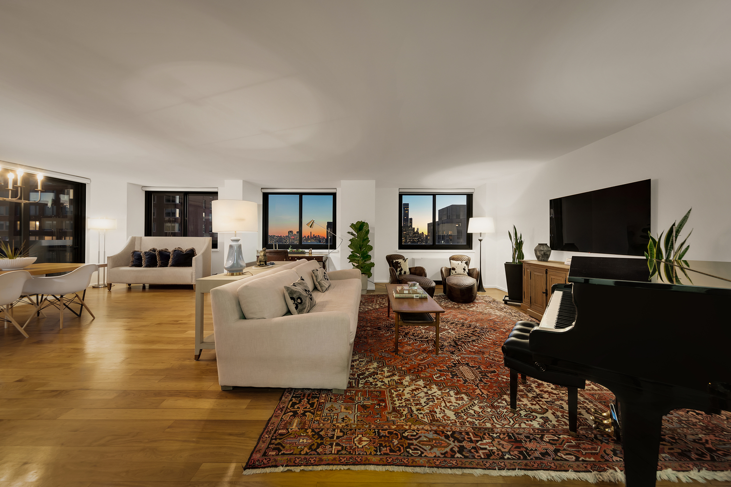 515 East 72nd Street, Unit 36B Manhattan, NY 10021 - Photo 15 of 36 a living room with furniture and a flat screen tv