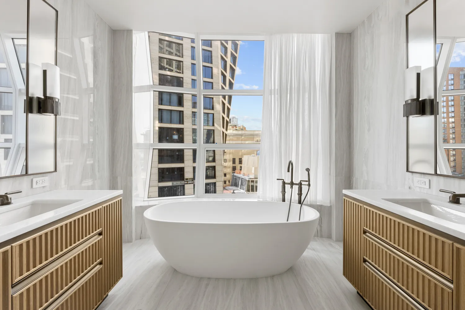 a spacious bathroom with a bathtub and sink