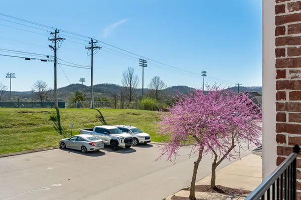 a view of a street with cars on road