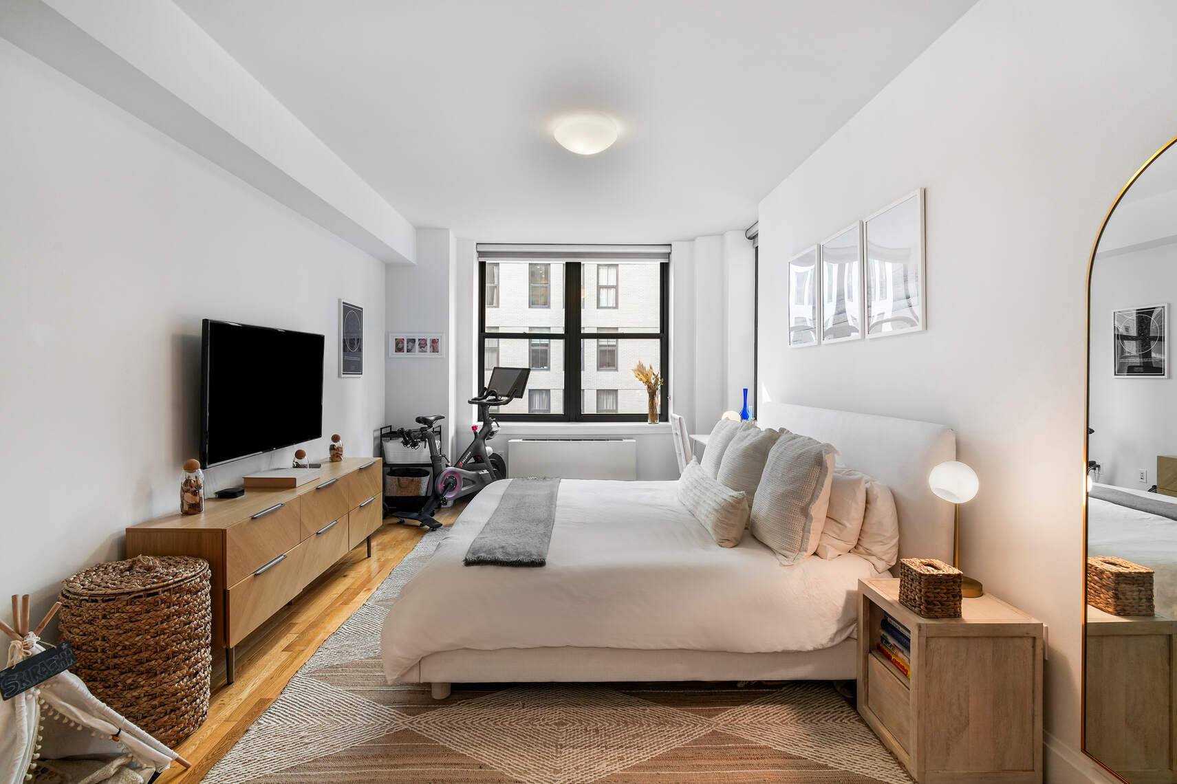 199 State Street, Unit 5C Brooklyn, NY 11201 - Photo 7 of 16 a bedroom with a bed and flat screen tv