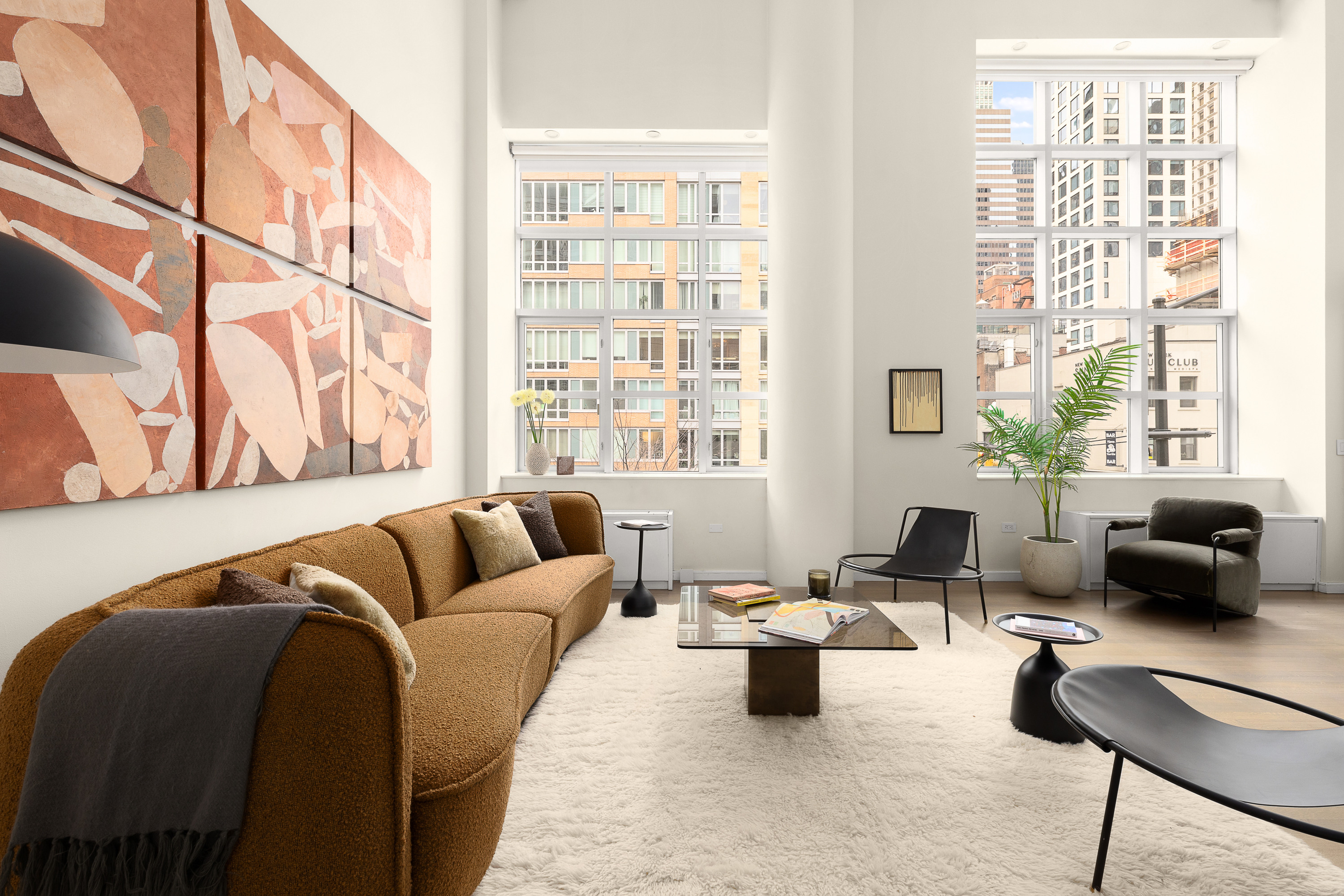 310 East 53rd Street, Unit 2/3D Manhattan, NY 10022 - Photo 2 of 13 a living room with furniture and a window