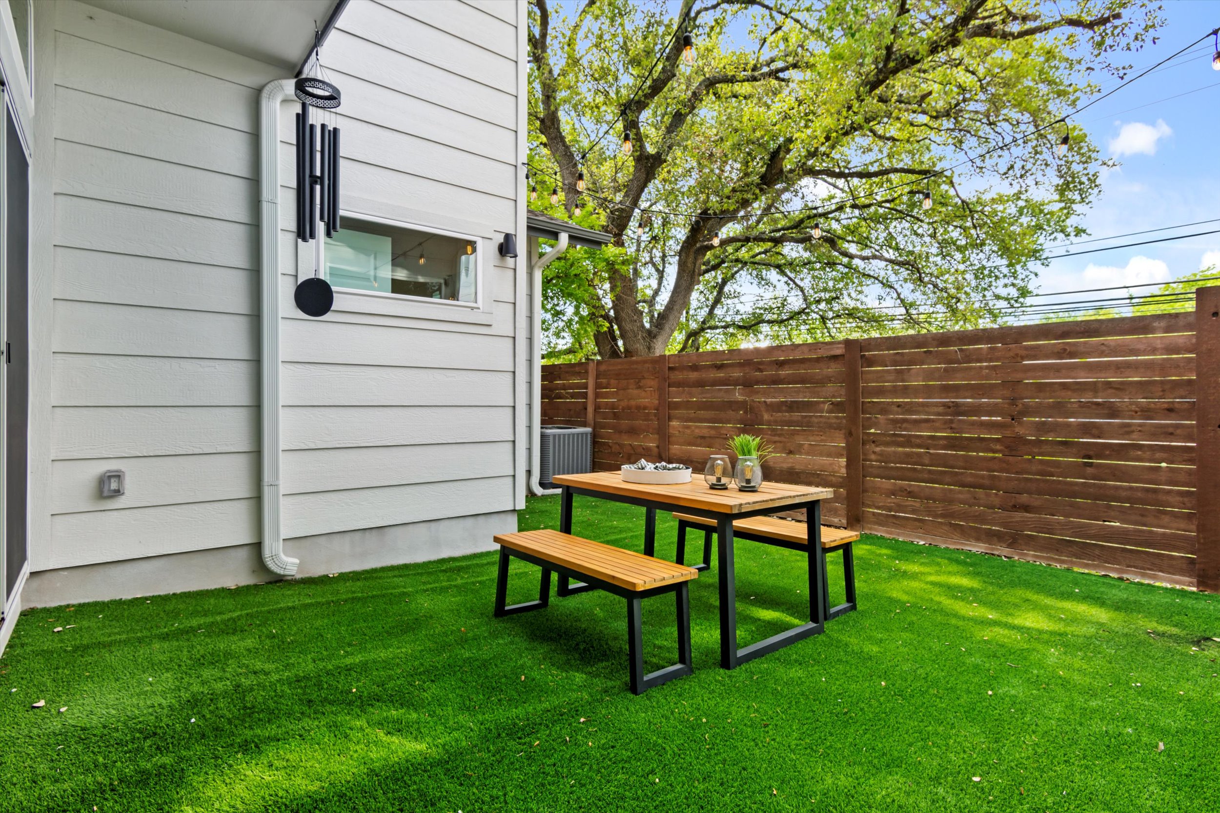 513 West Croslin Street, Unit A Austin, TX 78752 - Photo 29 of 39 a view of a wooden bench sitting in a backyard