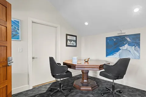 a work room with furniture and wooden floor