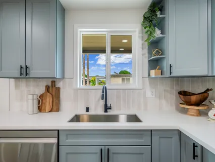 a kitchen with a sink and cabinets