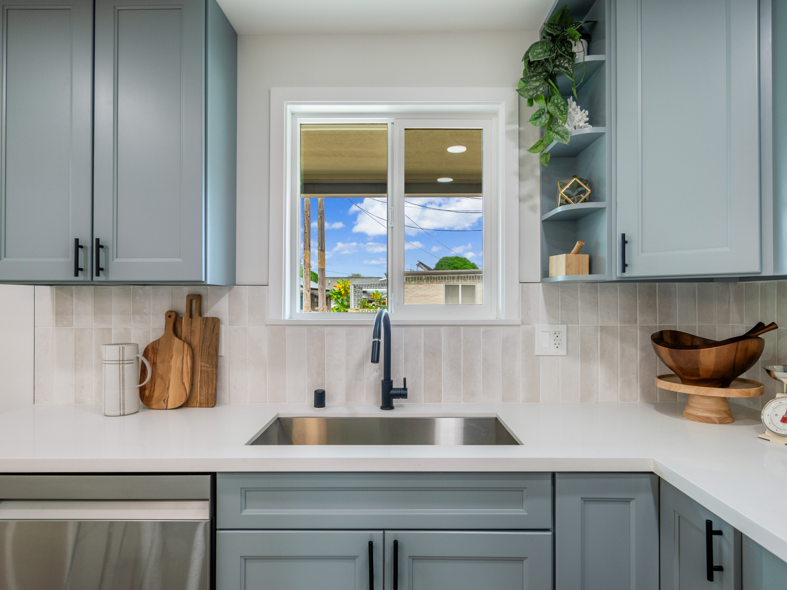 45-561 Paleka Road, Unit C Kaneohe, HI 96744 - Photo 3 of 27 a kitchen with a sink and cabinets