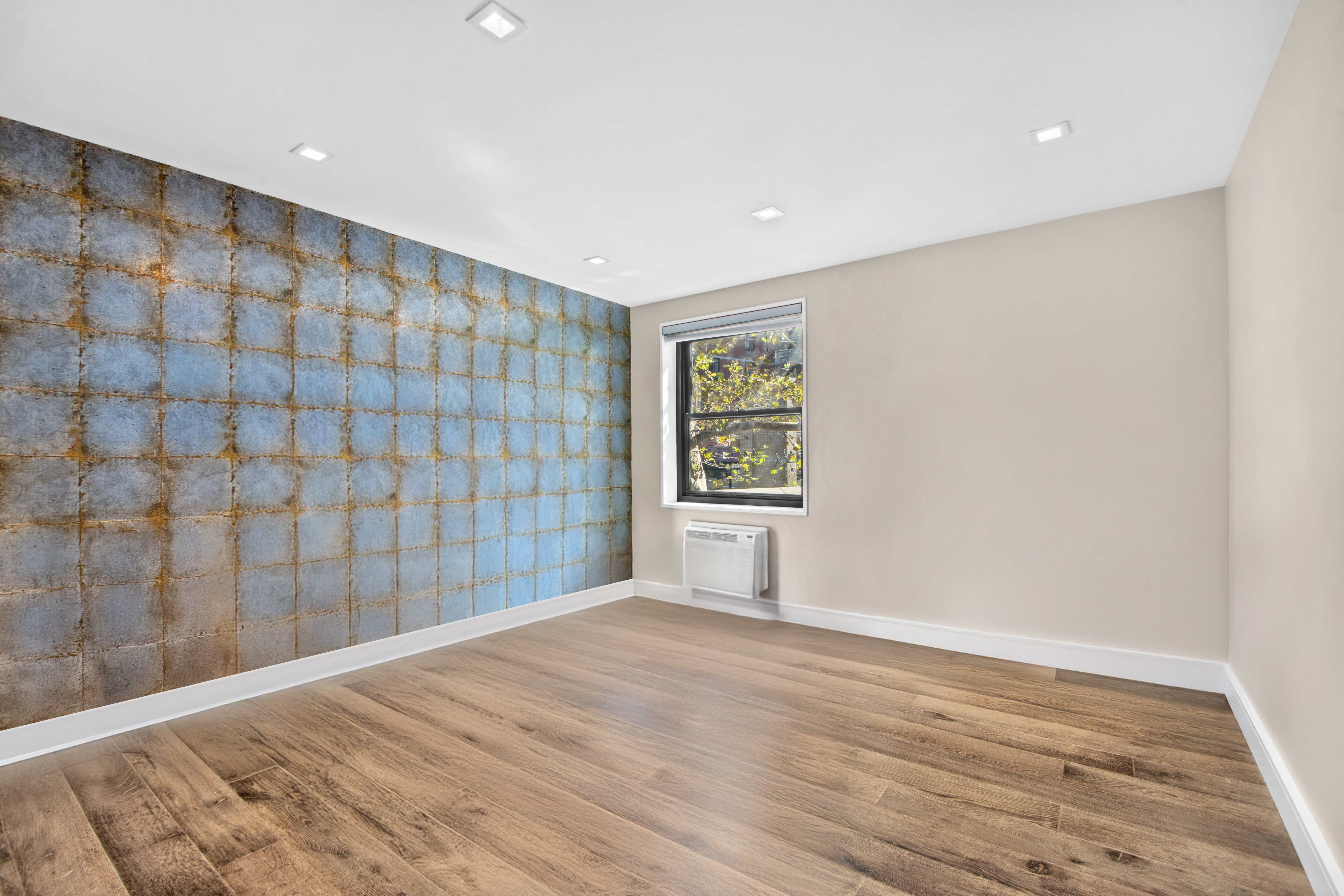 690 Washington Street, Unit 1A Manhattan, NY 10014 - Photo 9 of 17 a view of an empty room with a window
