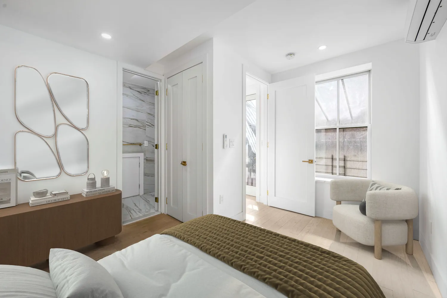 a bedroom with furniture and a window