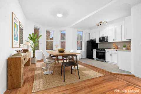 a kitchen with stainless steel appliances a refrigerator and a microwave