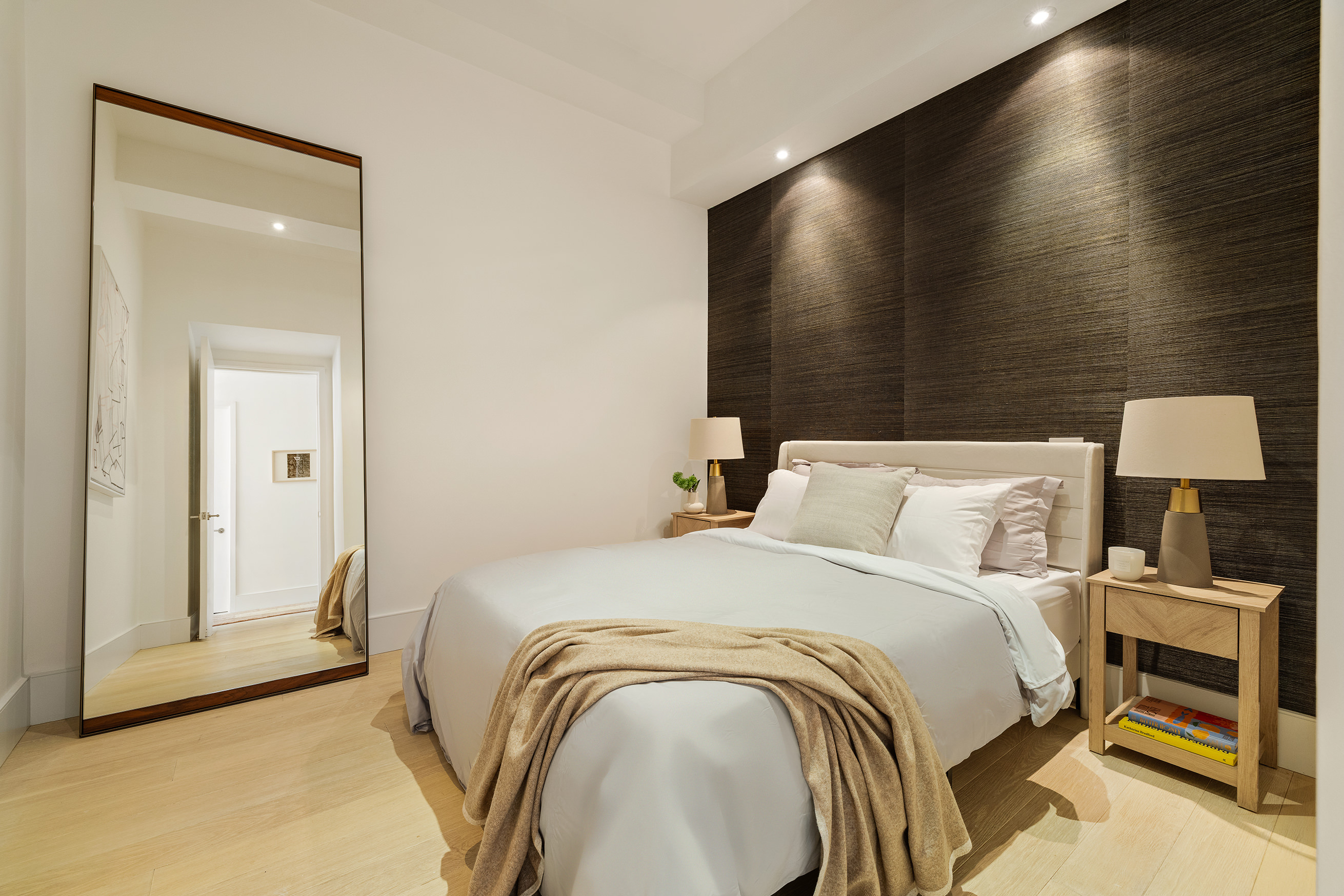 49 East 21st Street, Unit 9A Manhattan, NY 10010 - Photo 13 of 18 a bedroom with a bed and a mirror