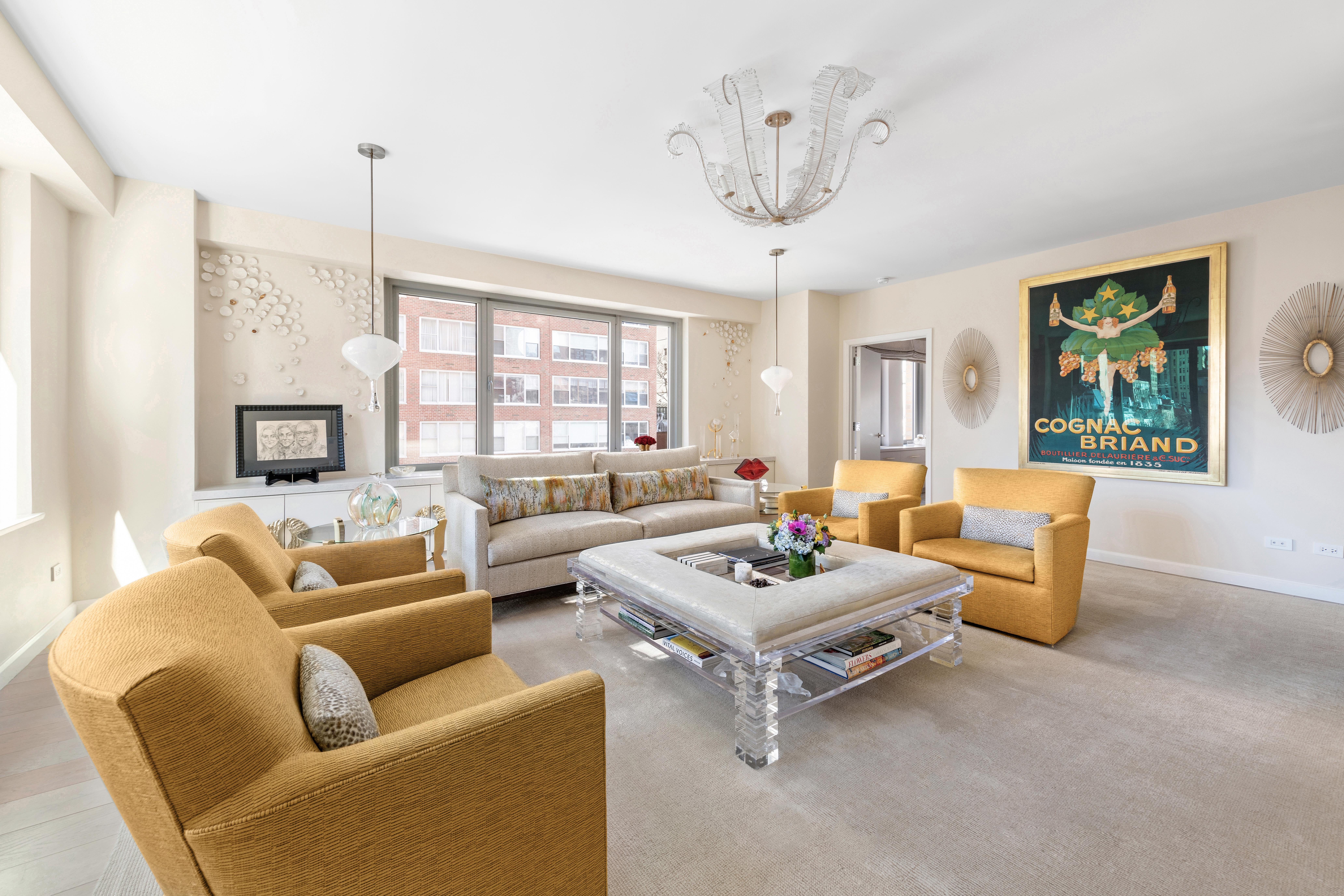 200 East 62nd Street, Unit 5A Manhattan, NY 10065 - Photo 3 of 25 a living room with furniture and a large window