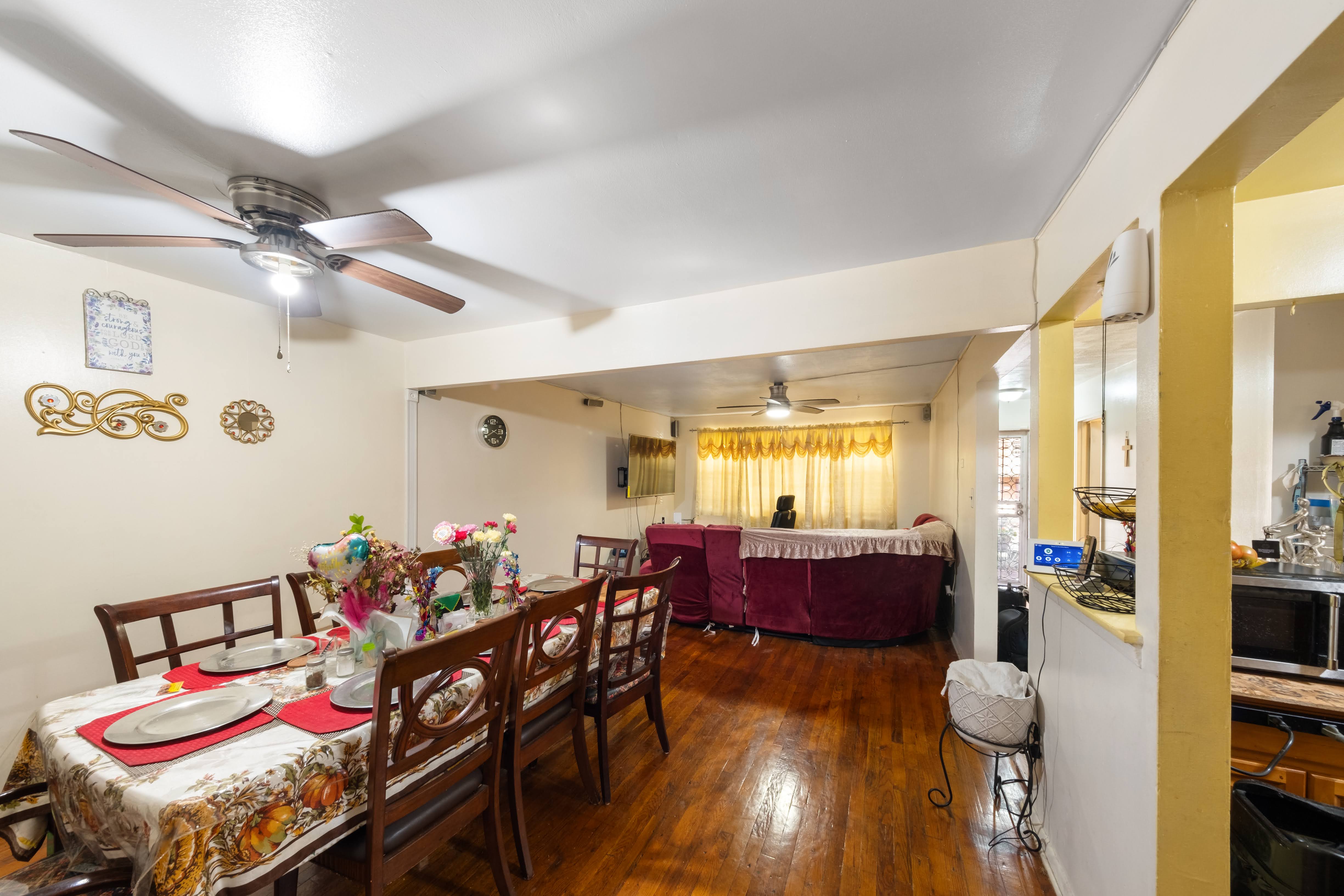 1464 East 84th Street Brooklyn, NY 11236 - Photo 5 of 22 a view of a dining room with furniture and chandelier