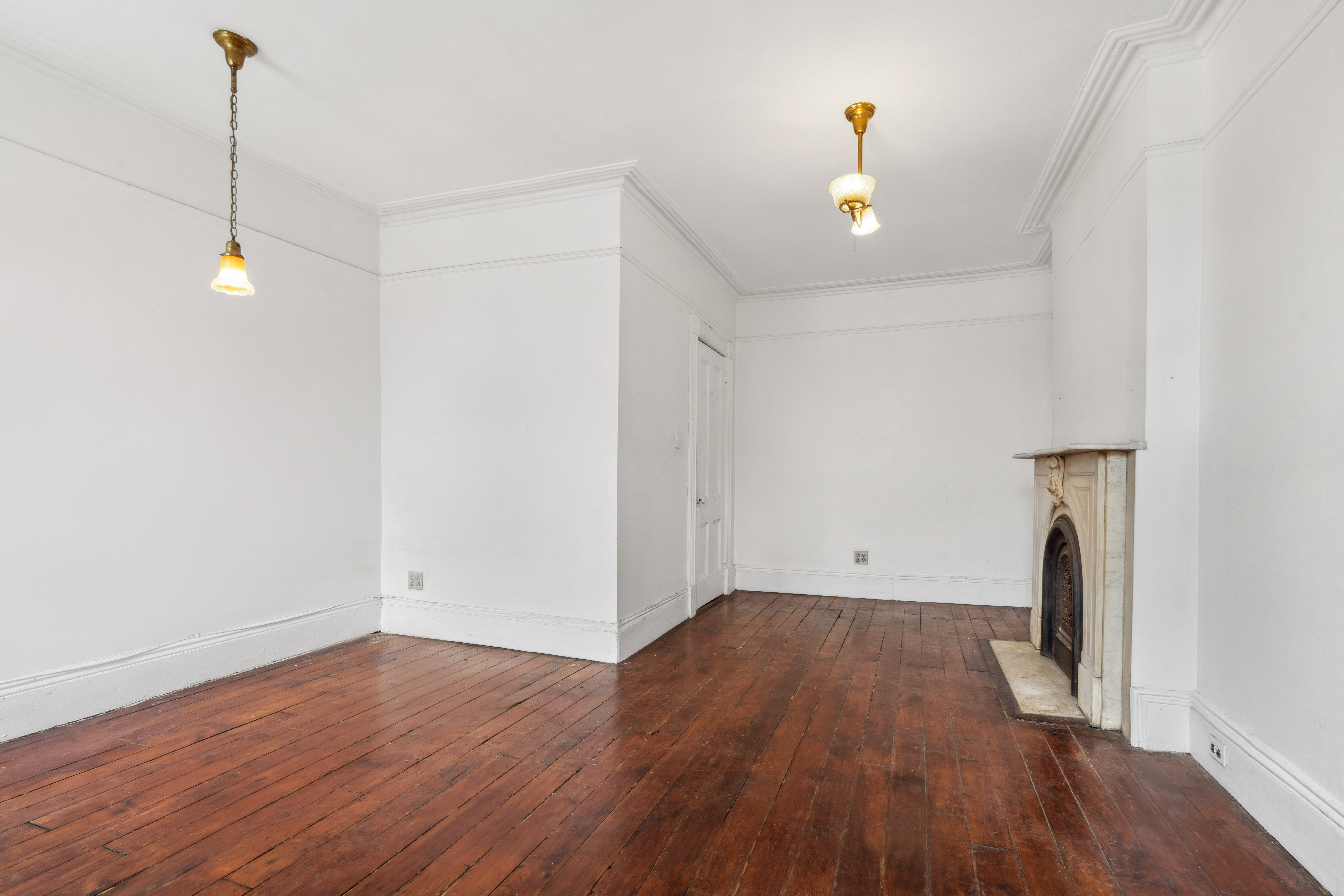 509 6th Avenue Brooklyn, NY 11215 - Photo 11 of 20 a view of a room with wooden floor and a ceiling fan