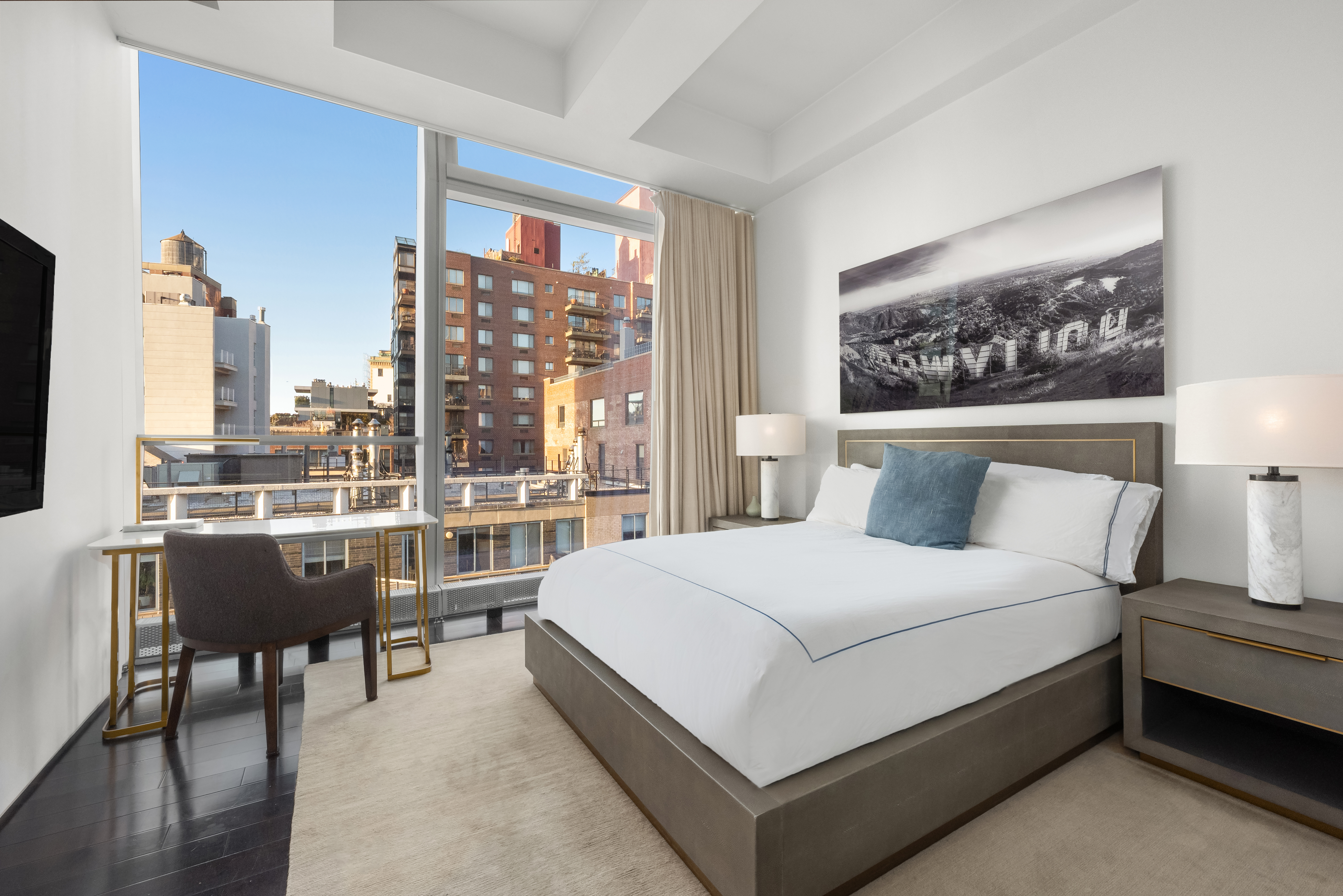 166 Perry Street, Unit 6A Manhattan, NY 10014 - Photo 11 of 20 a bedroom with a large bed and a window