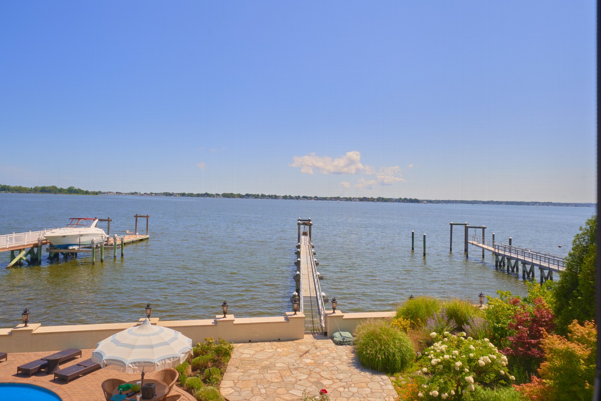 3411 Country Club Road Bronx, NY 10465 - Photo 19 of 54 a view of a lake with a house