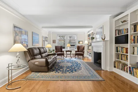 a living room with furniture and a rug