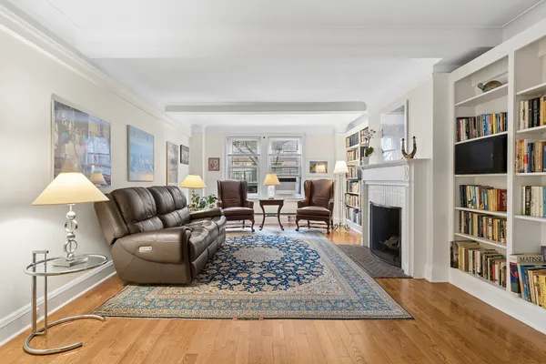 a living room with furniture and a rug