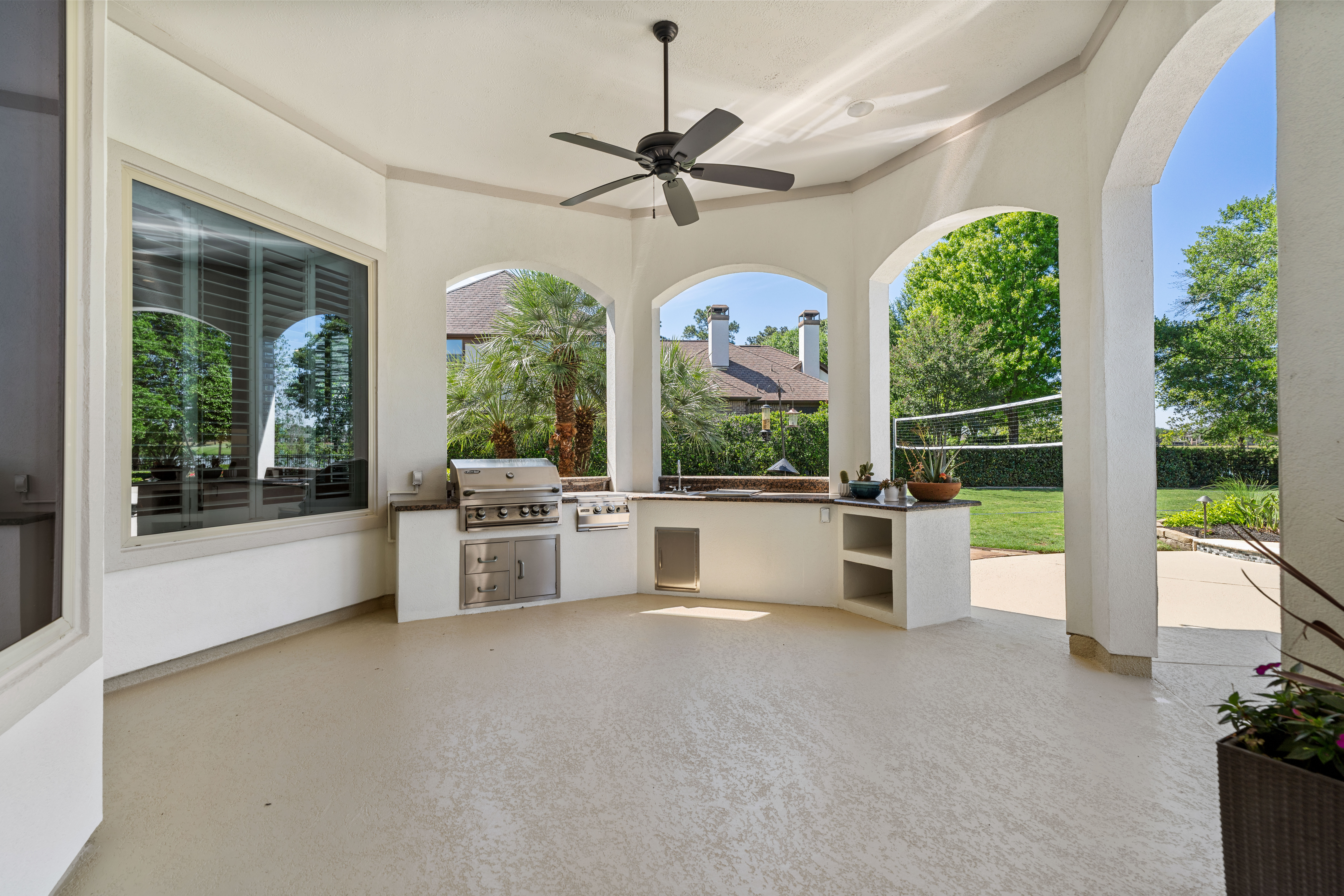 82 Manor Lake Estates Circle Spring, TX 77379 - Photo 38 of 52 a large white kitchen with a large window and stainless steel appliances