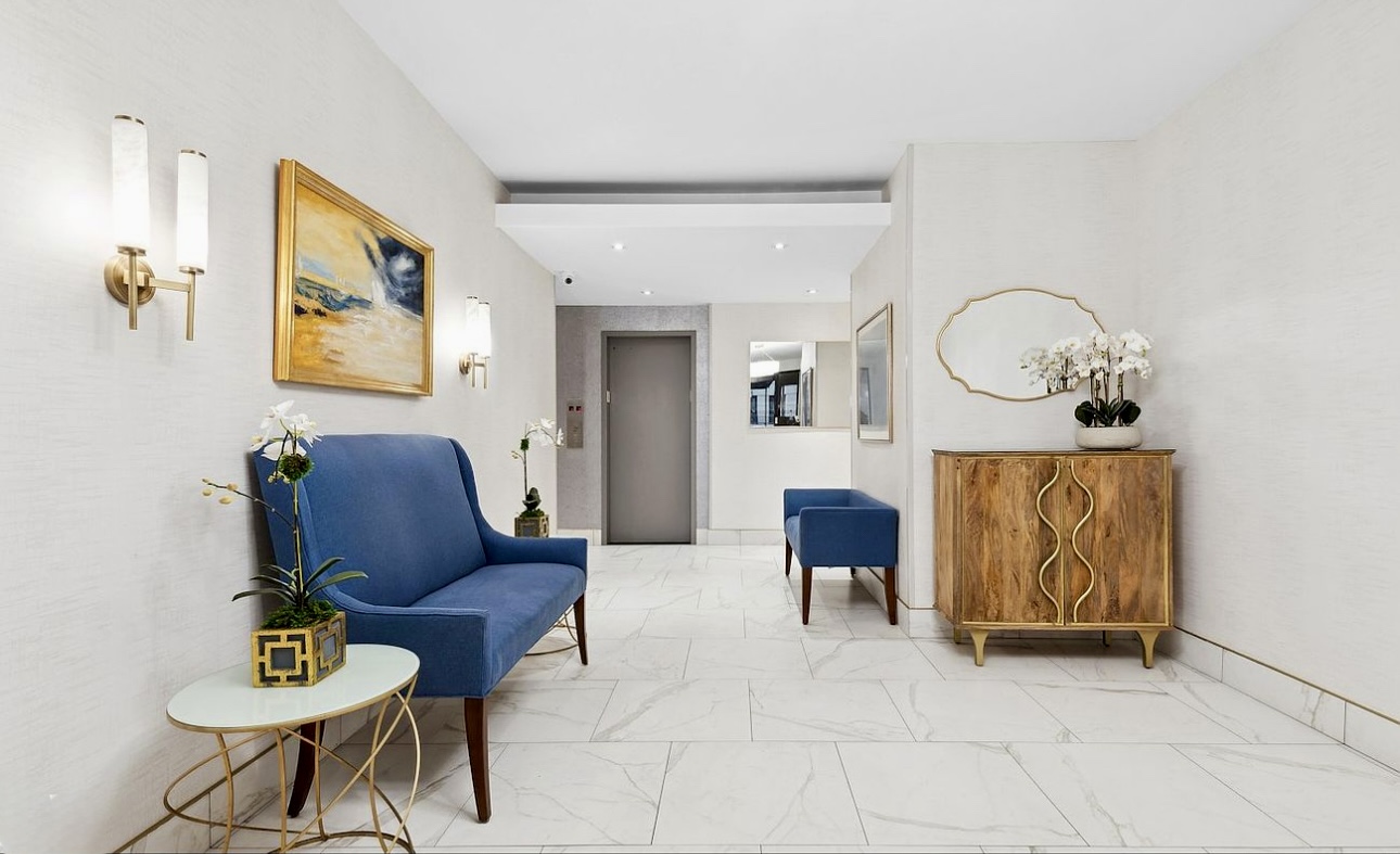 525 East 82nd Street, Unit 12E Manhattan, NY 10028 - Photo 25 of 29 a living room with furniture and wooden floor