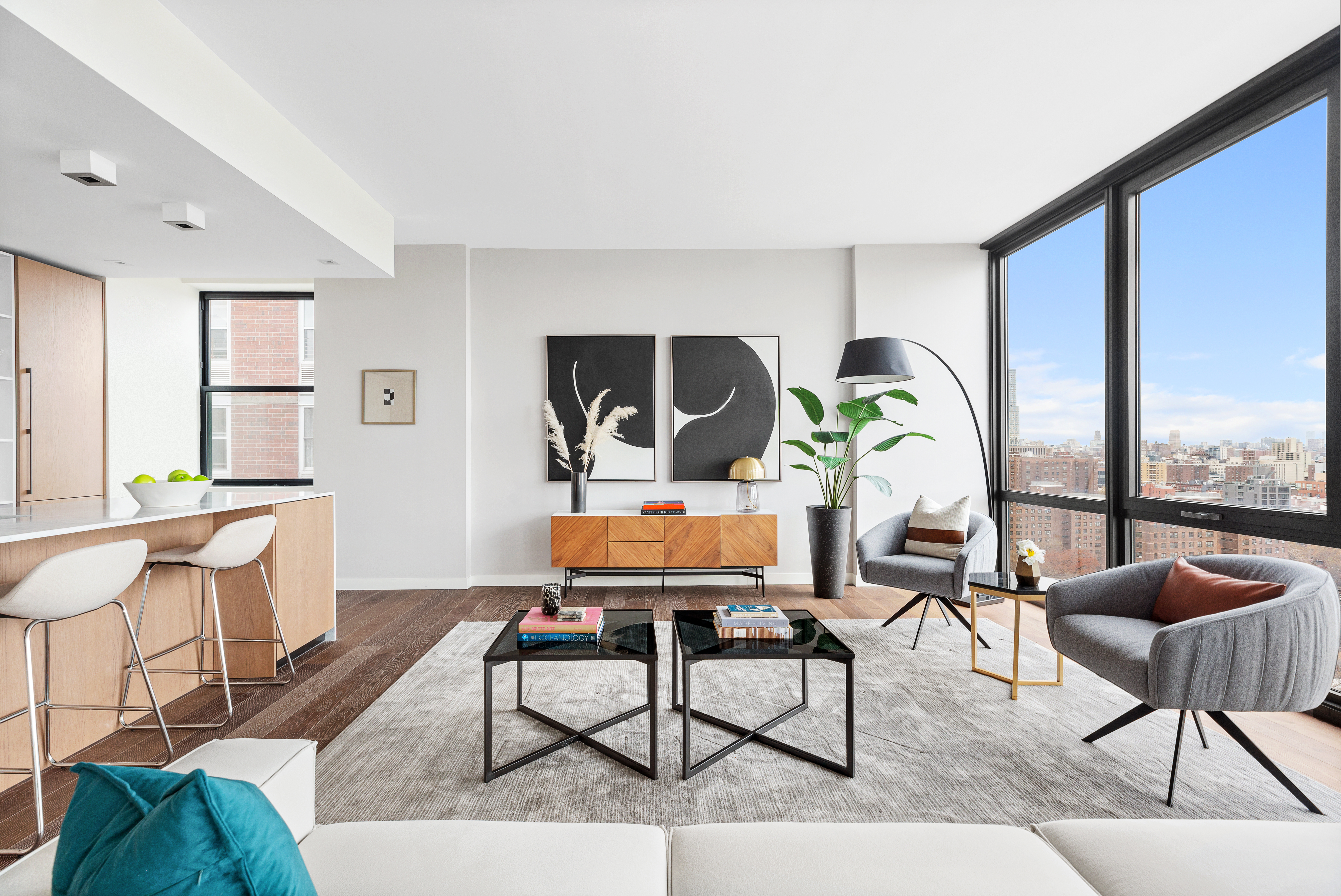 302 East 96th Street, Unit PH6 Manhattan, NY 10128 - Photo 2 of 13 a living room with furniture and a large window