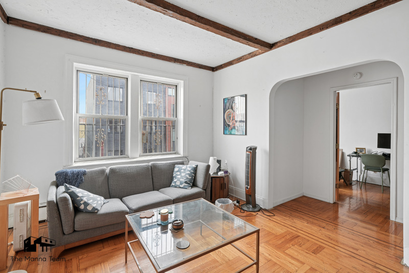 495 Lorimer Street Brooklyn, NY 11211 - Photo 13 of 24 a living room with furniture and a large window