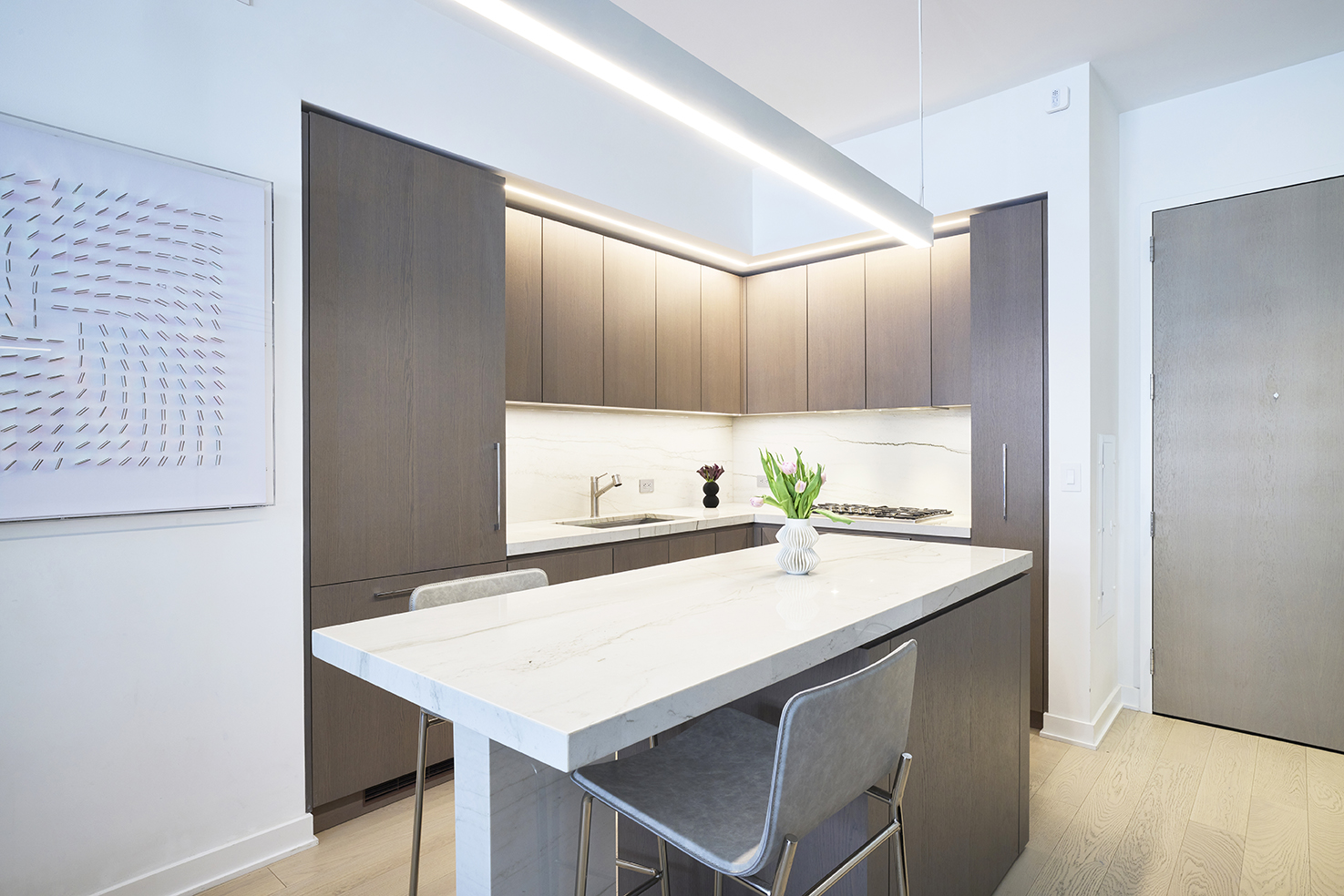 77 Charlton Street, Unit N10C Manhattan, NY 10014 - Photo 2 of 24 a kitchen with a sink a stove and cabinets