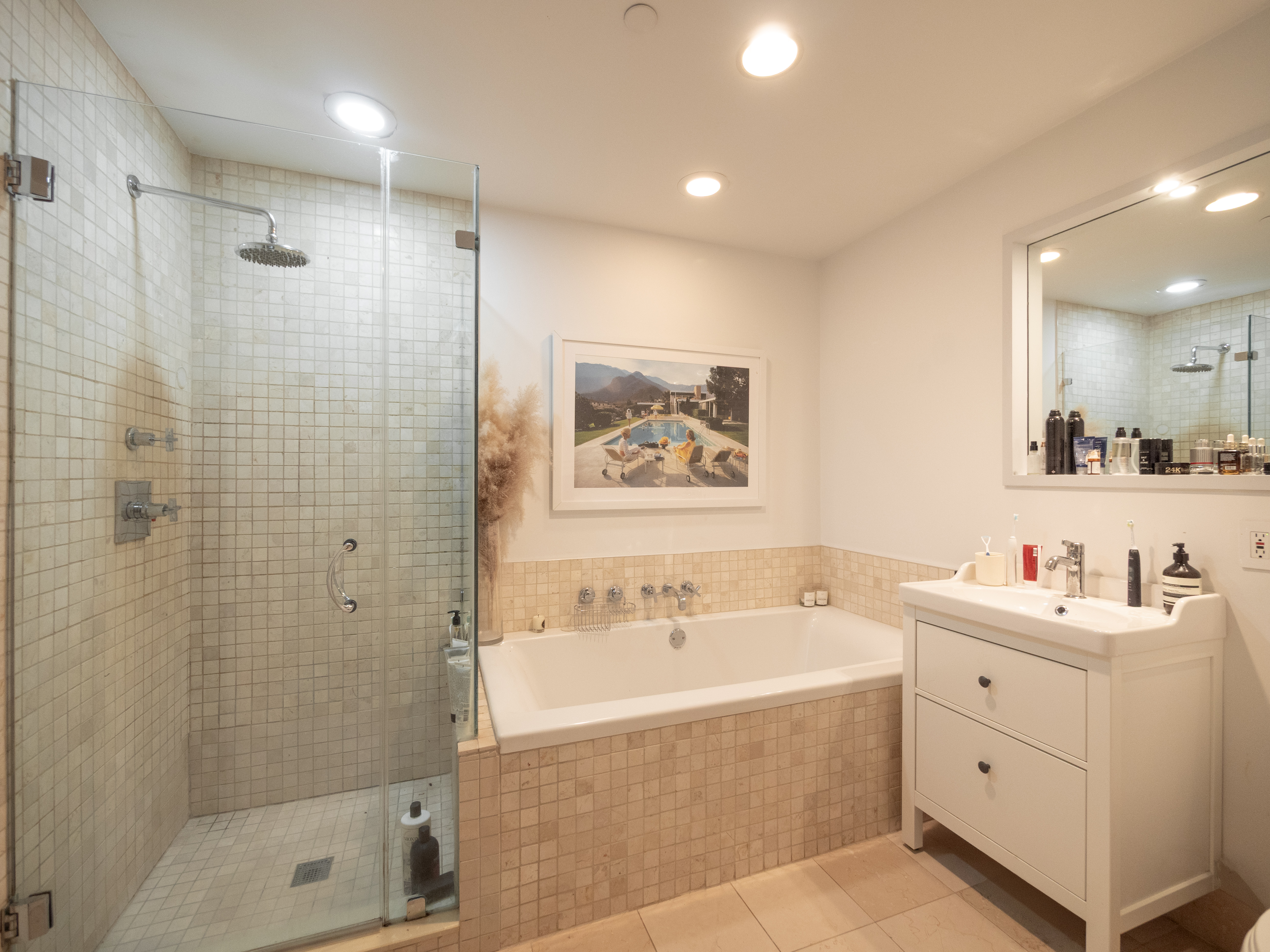 84 Front Street, Unit 5E Brooklyn, NY 11201 - Photo 8 of 11 a bathroom with a tub sink a shower and a mirror