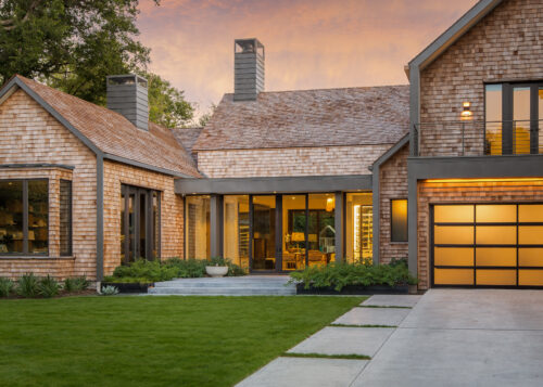 5716 Stonegate Road Dallas, TX 75209 - Photo 2 of 25 a view of a brick house with a large windows and plants