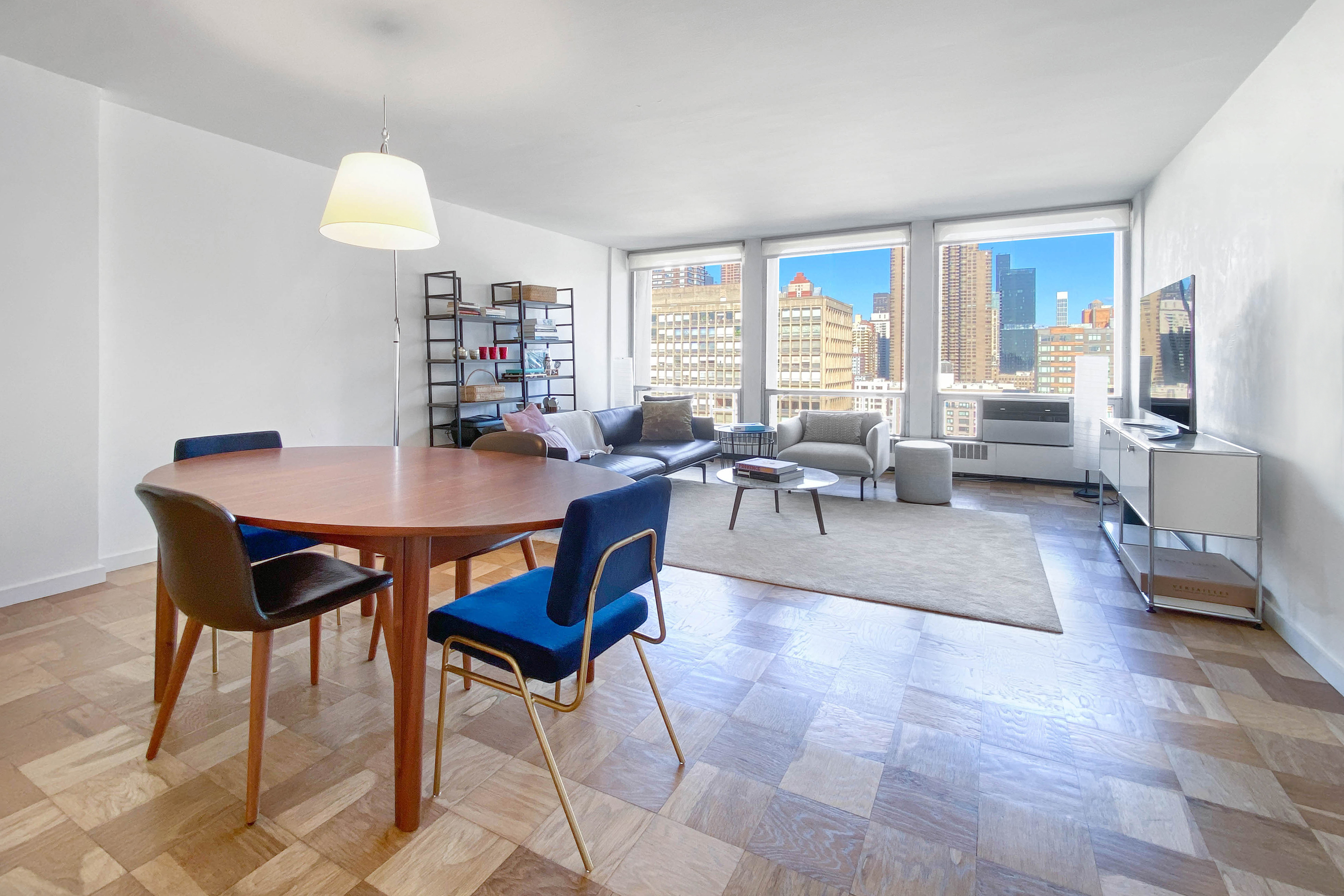 343 East 30th Street, Unit 18A Manhattan, NY 10016 - Photo 4 of 17 a living room with furniture and a large window
