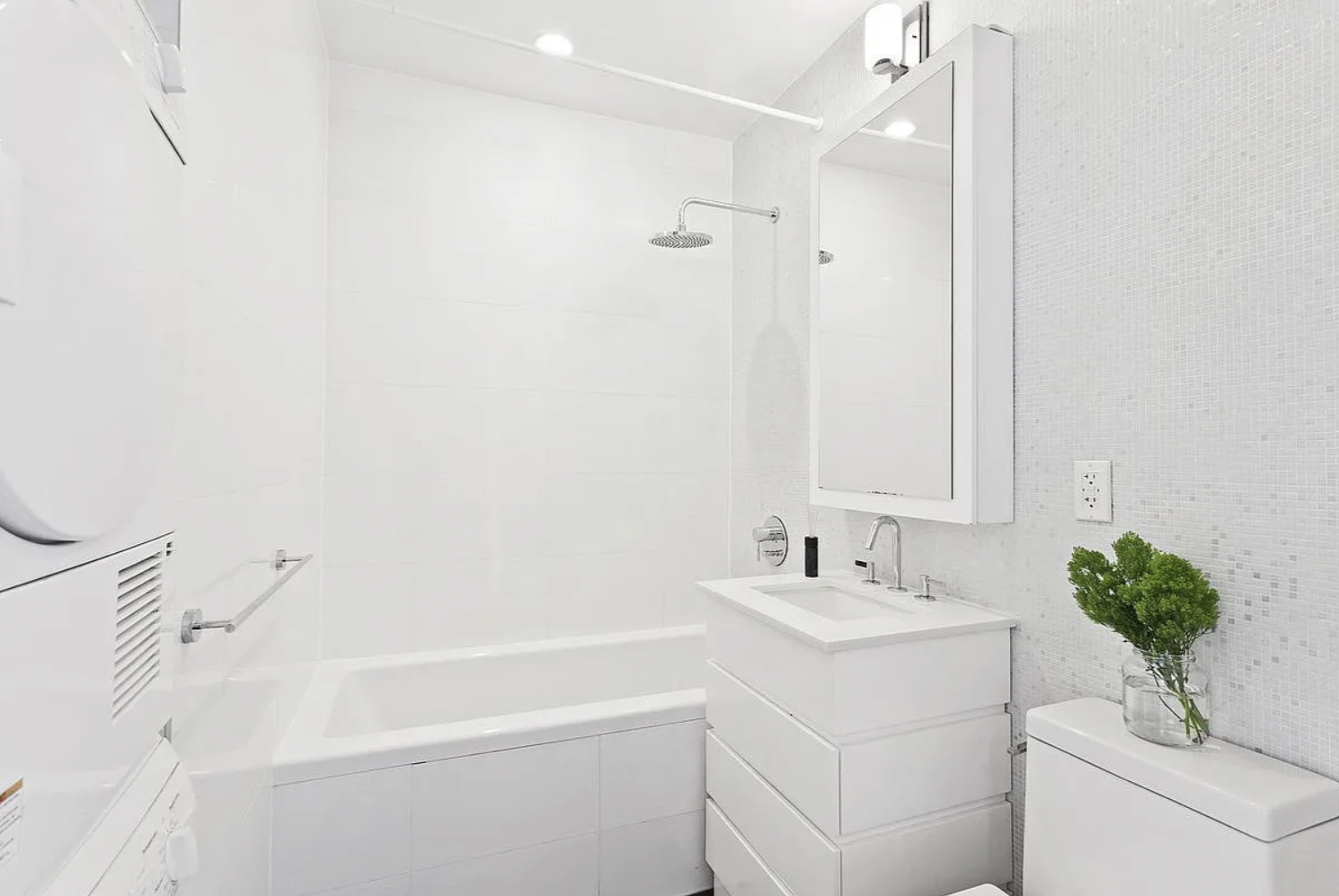 65 North 6th Street, Unit 3D Brooklyn, NY 11249 - Photo 3 of 7 a bathroom with a sink a bathtub and a shower