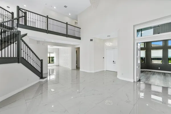 a view of staircase with white walls and stairs