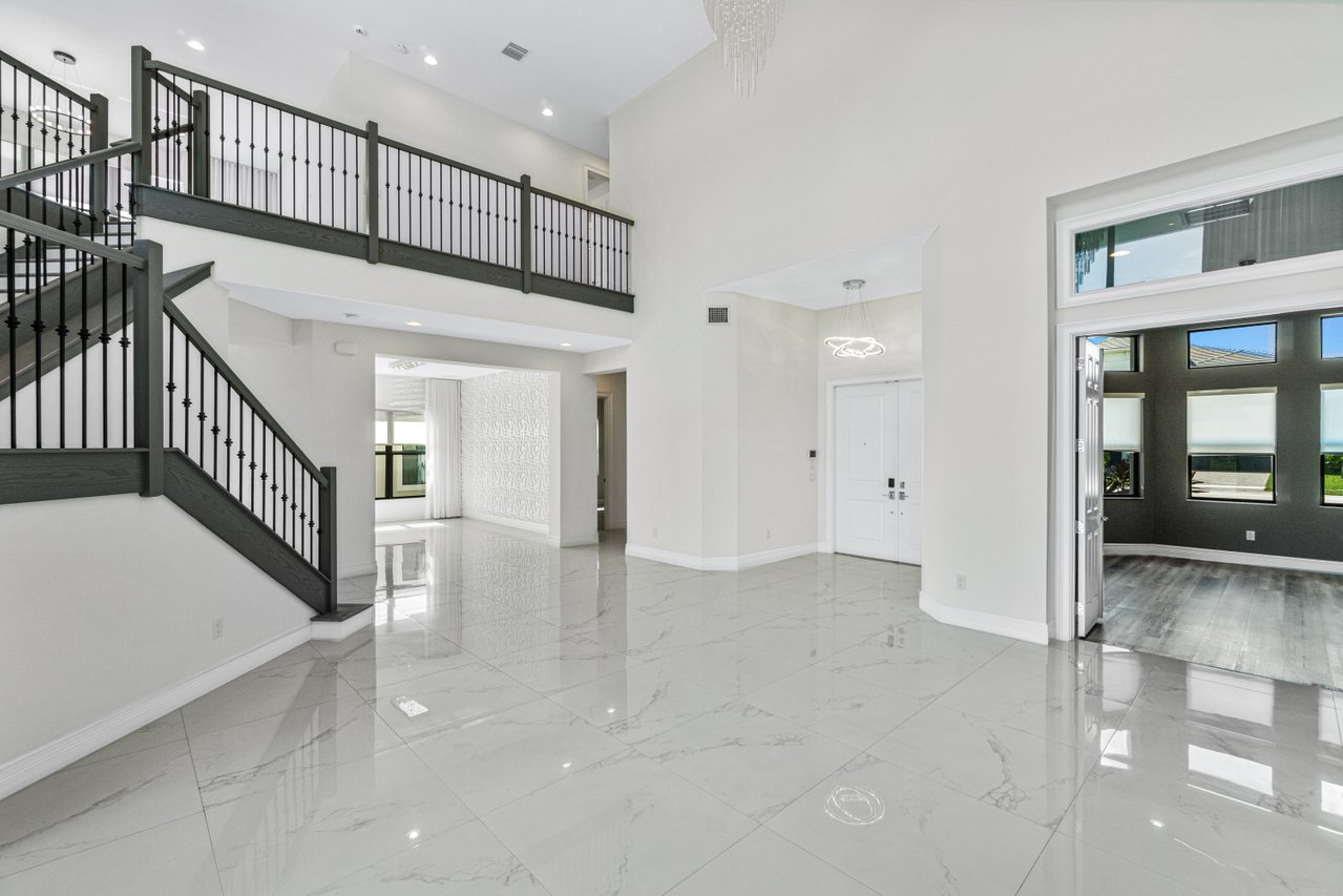 17352 Rosella Road Boca Raton, FL 33496 - Photo 6 of 41 a view of staircase with white walls and stairs