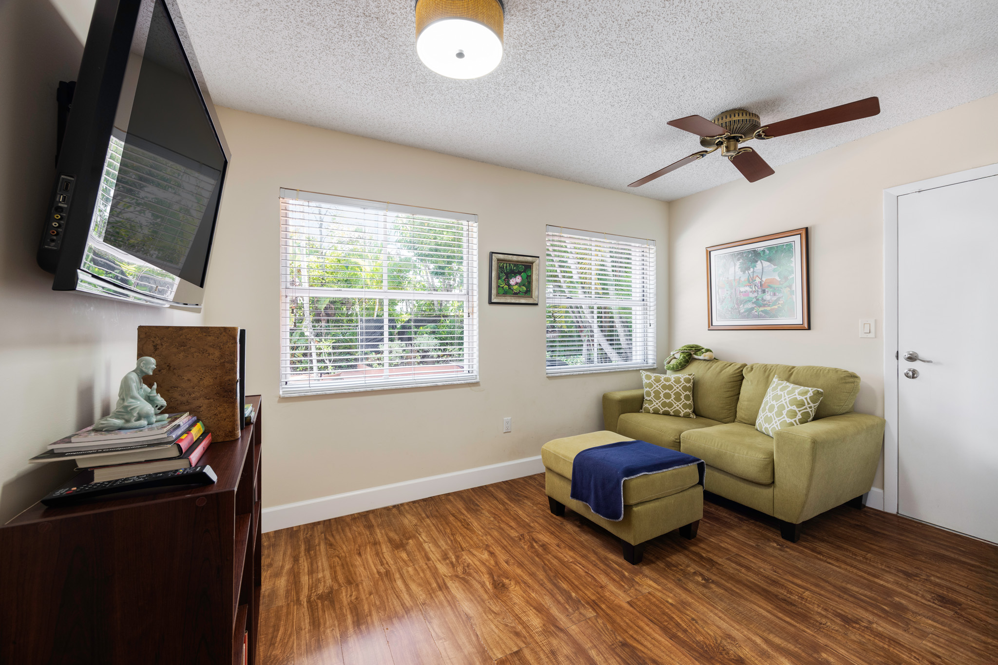 8610 Southwest 83rd Street Miami, FL 33143 - Photo 22 of 46 a living room with furniture and a flat screen tv
