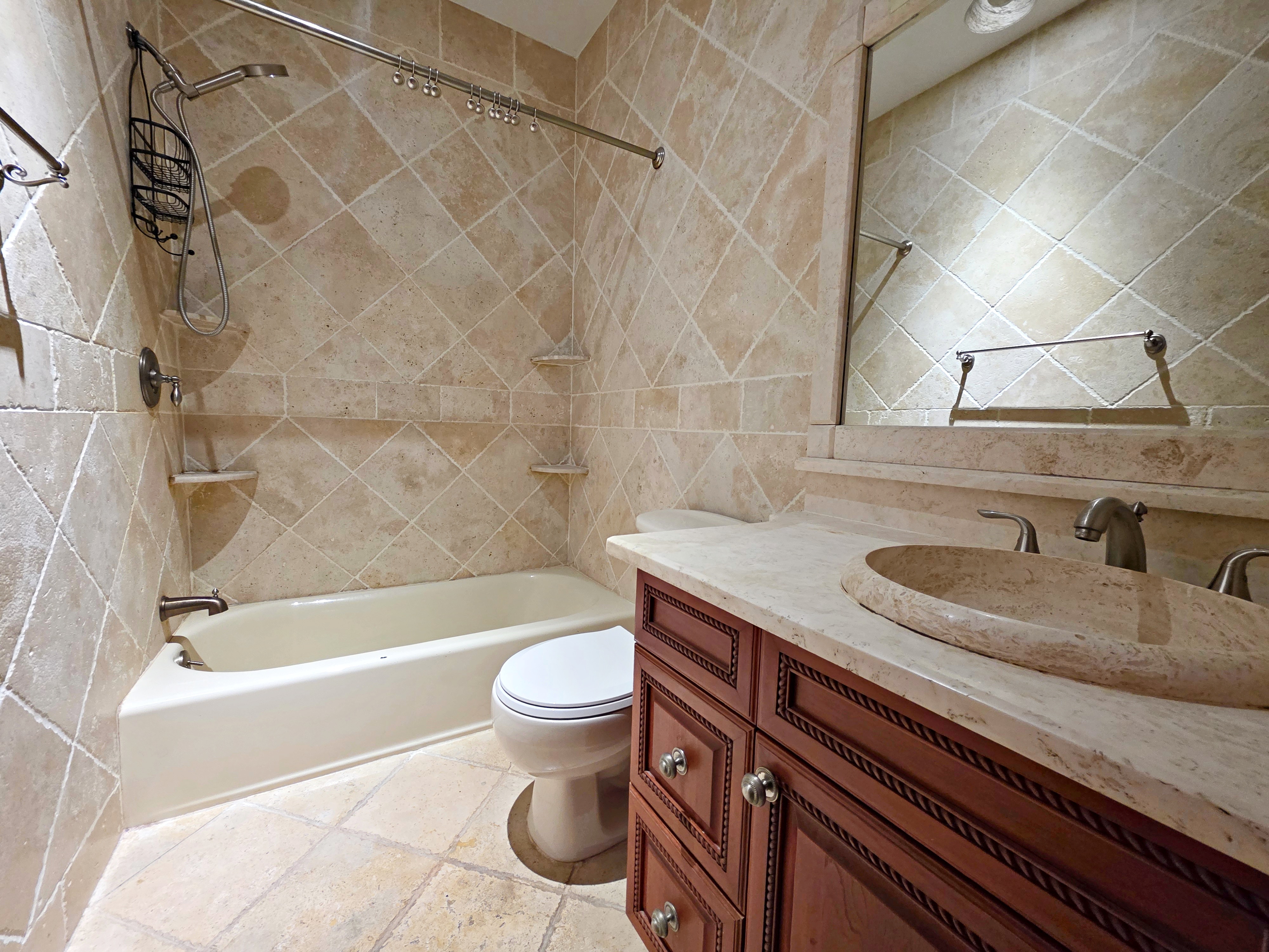 714 Lorimer Street, Unit 1 Brooklyn, NY 11211 - Photo 3 of 7 a bathroom with a sink a toilet and bathtub