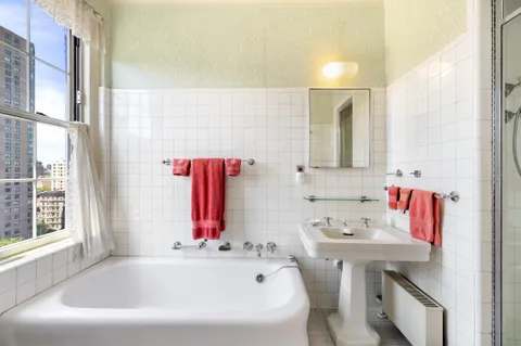 a bathroom with a bathtub and a sink