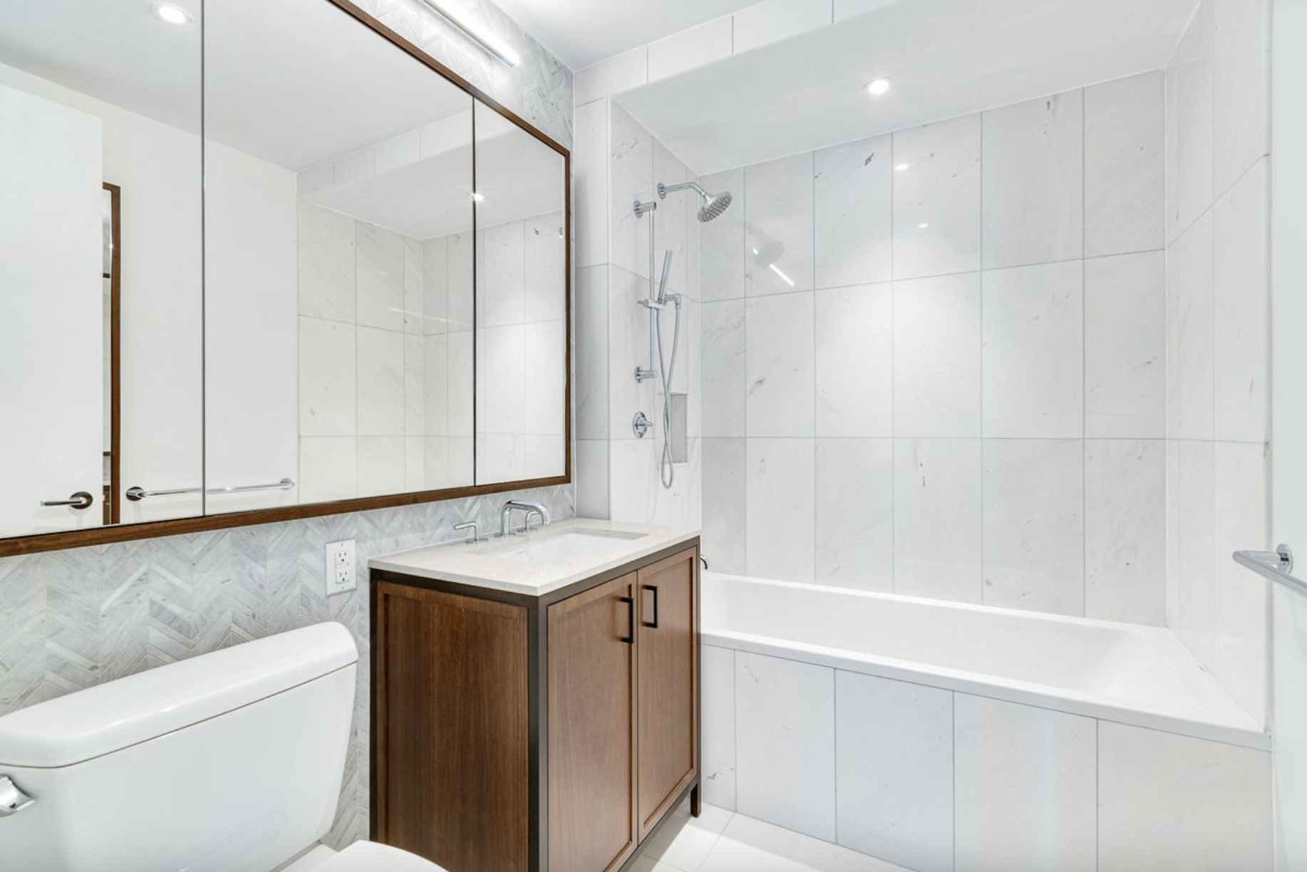 10 Lenox Avenue, Unit 5D Manhattan, NY 10026 - Photo 6 of 13 a bathroom with a granite countertop sink a toilet and shower