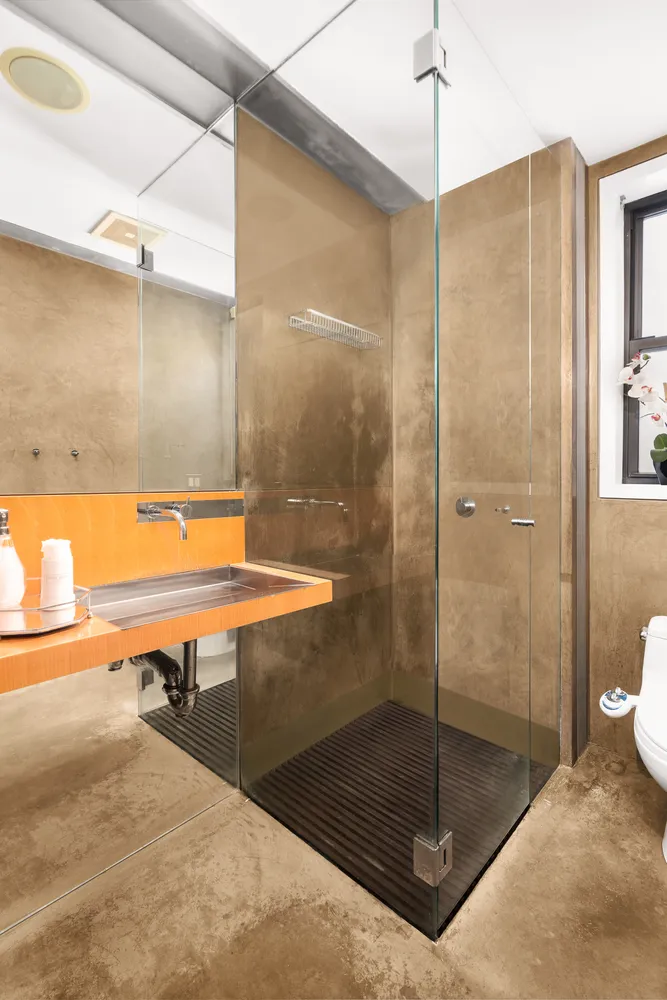 a bathroom with a shower and a sink